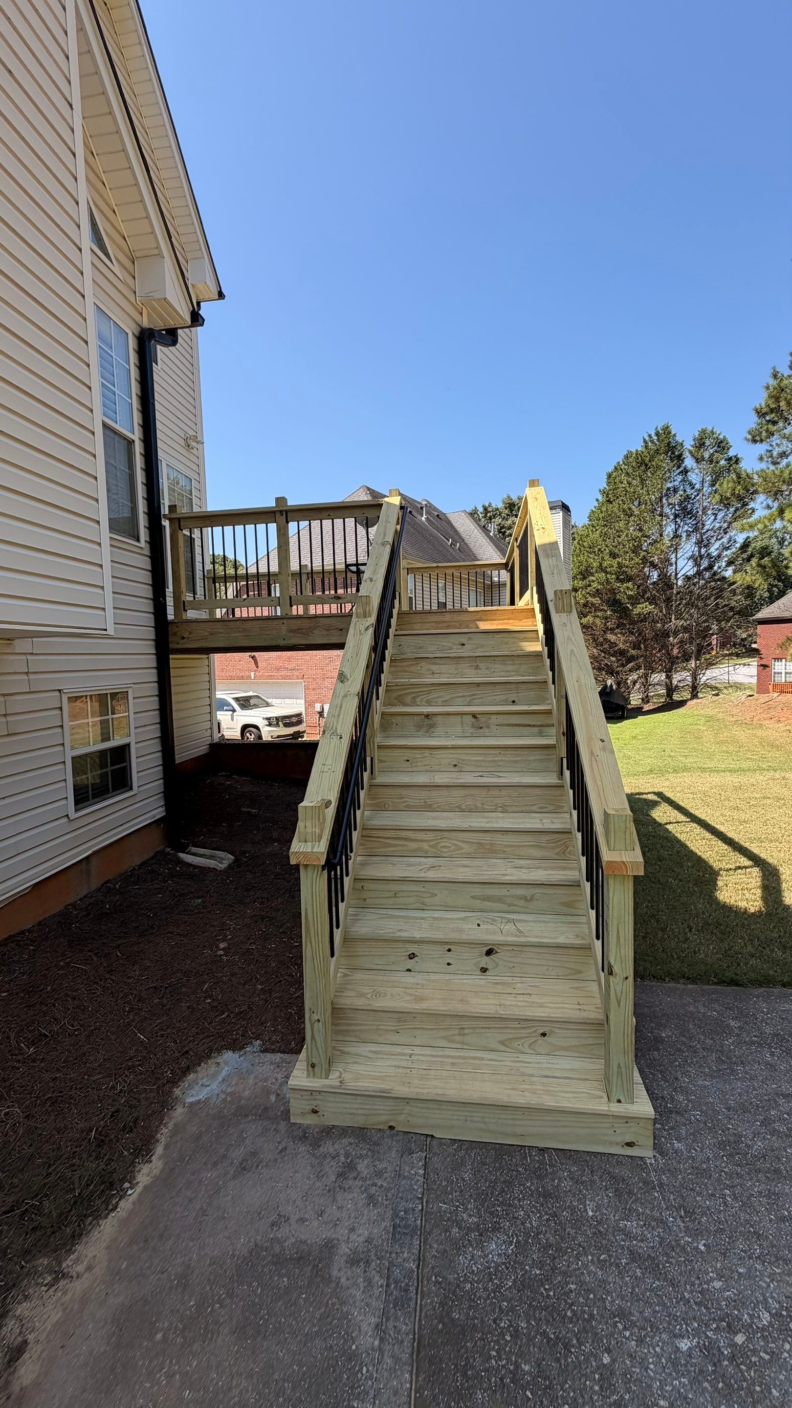 Elevated Pressure-Treated Deck and Staircase Rebuild in Douglasville by Swift Home Renovations