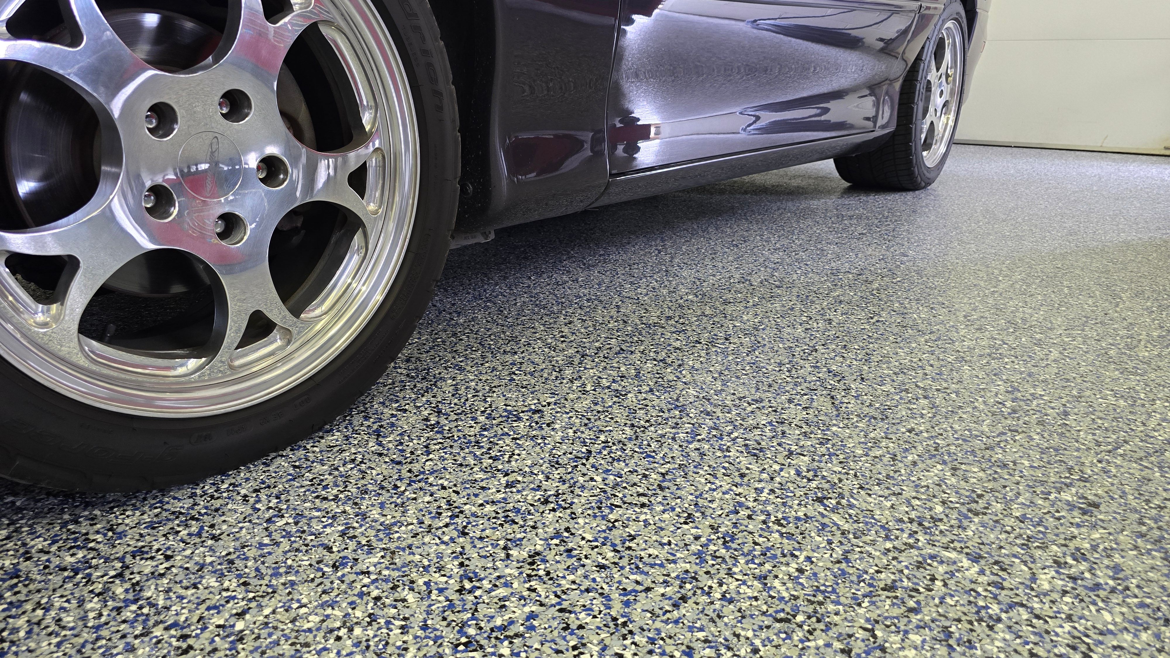 Two garages completed using Shoreline and Midnight by Elite Floor Solutions