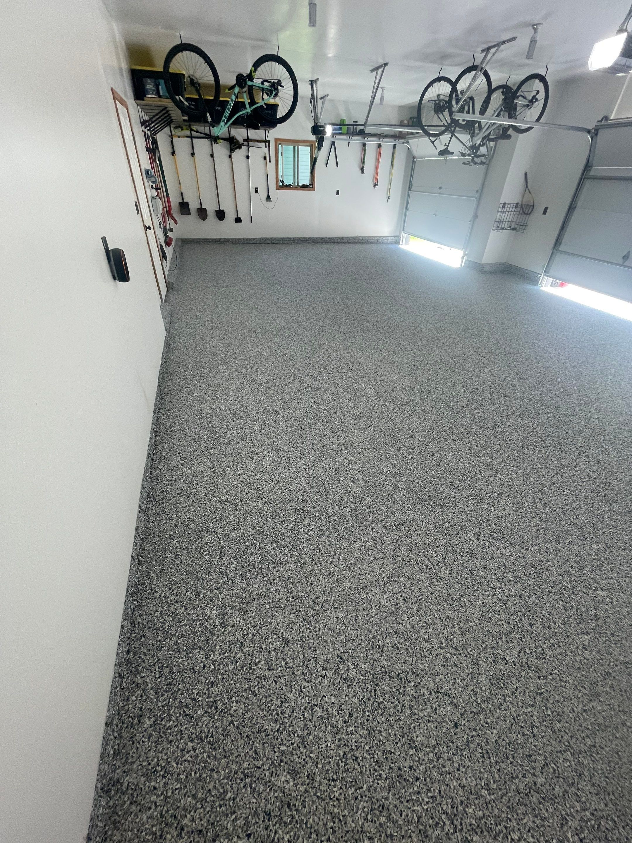 Tidal Wave Flake Garage Floor Installation in Sioux Falls by Select Painting, Coatings & Garage Cabinets