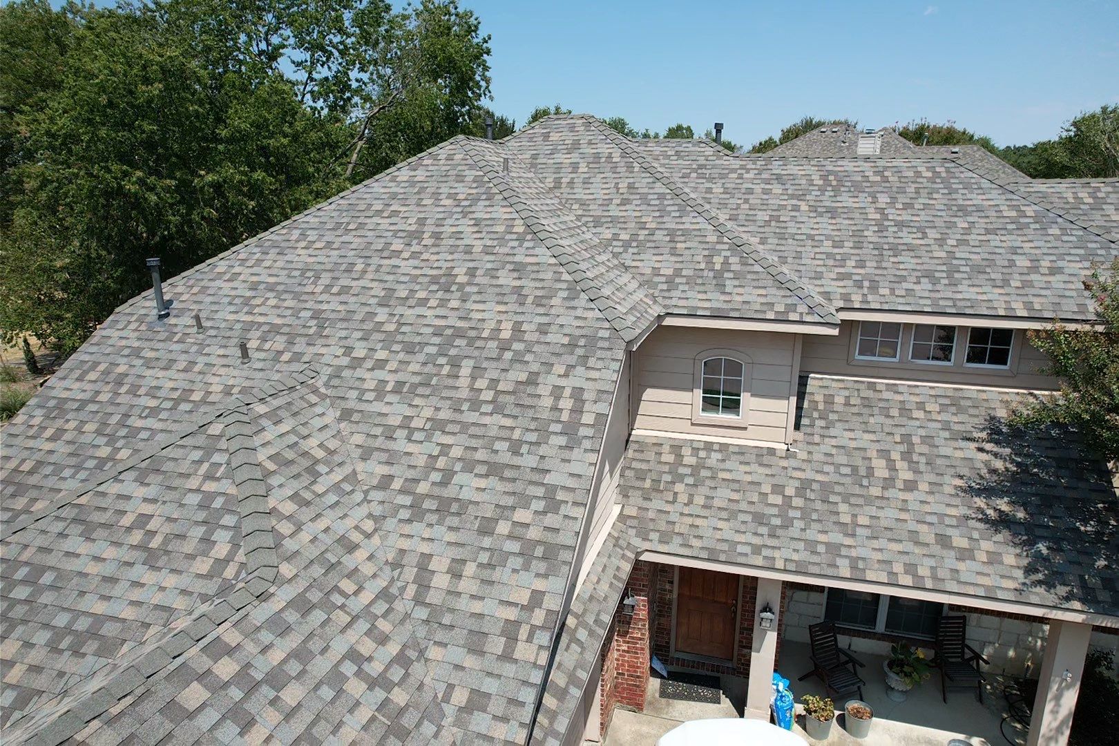 Red brick/white stone with IKO Cornerstone by Tejas Roofworks + Restoration