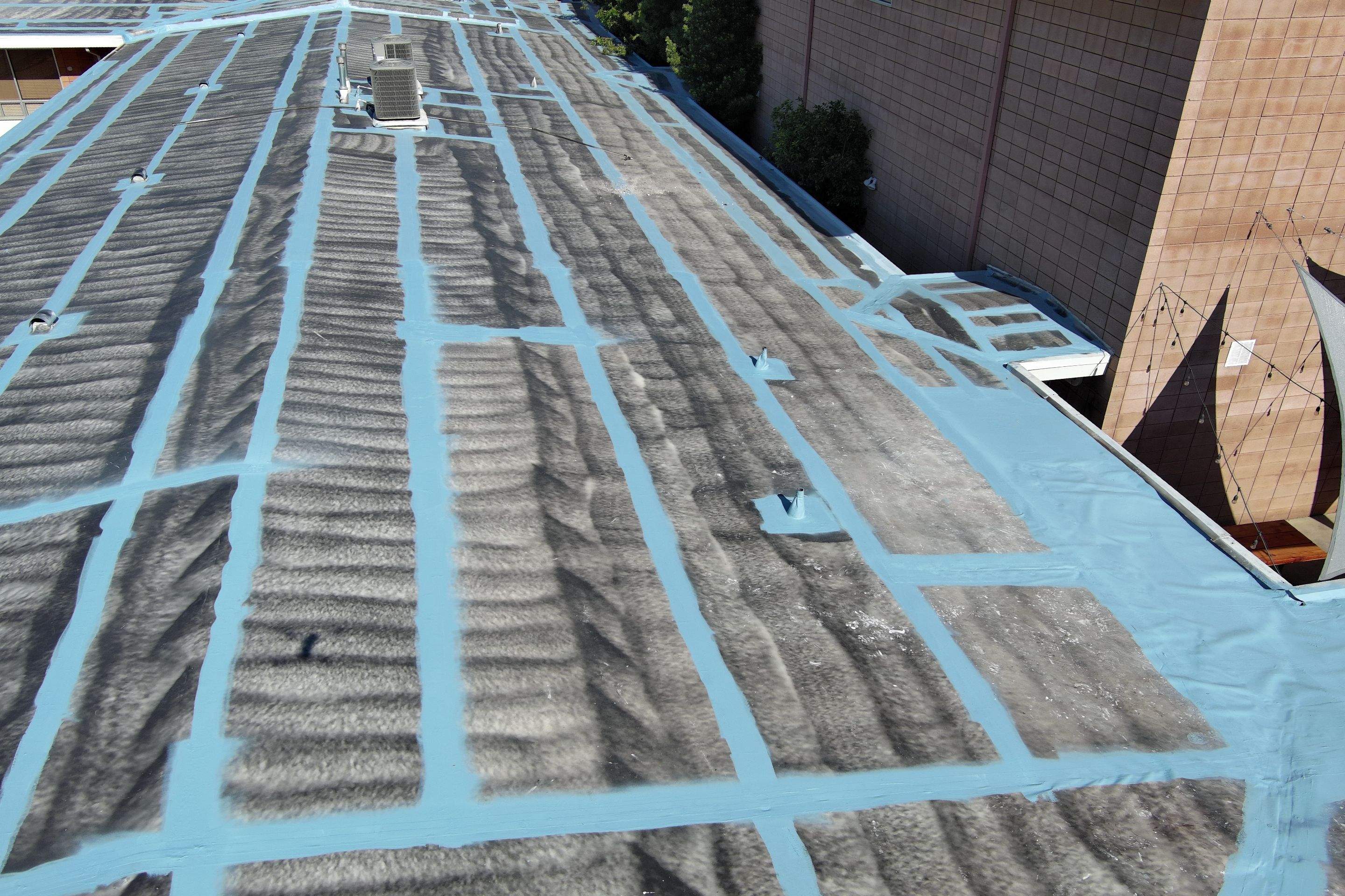 Single-ply restoration system using Benchmark/PUMA XL coatings over TPO single-ply roofing by Straight Edge Roofing Inc