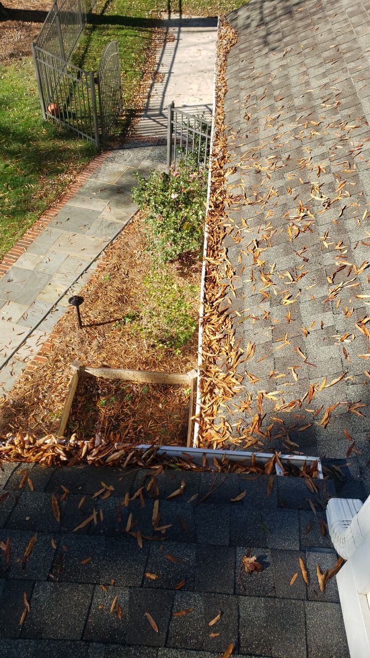 Sara Gutter cleanout using water by Power Wash Masters LLC