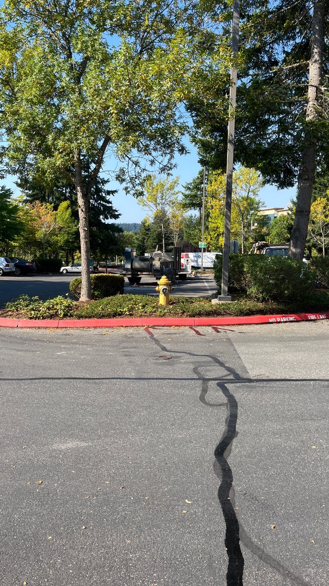 Kidder Matthews | Parking Lot Sealcoating & Striping with Concrete Curb & Patch Repairs  by Jireh Asphalt & Concrete Inc 