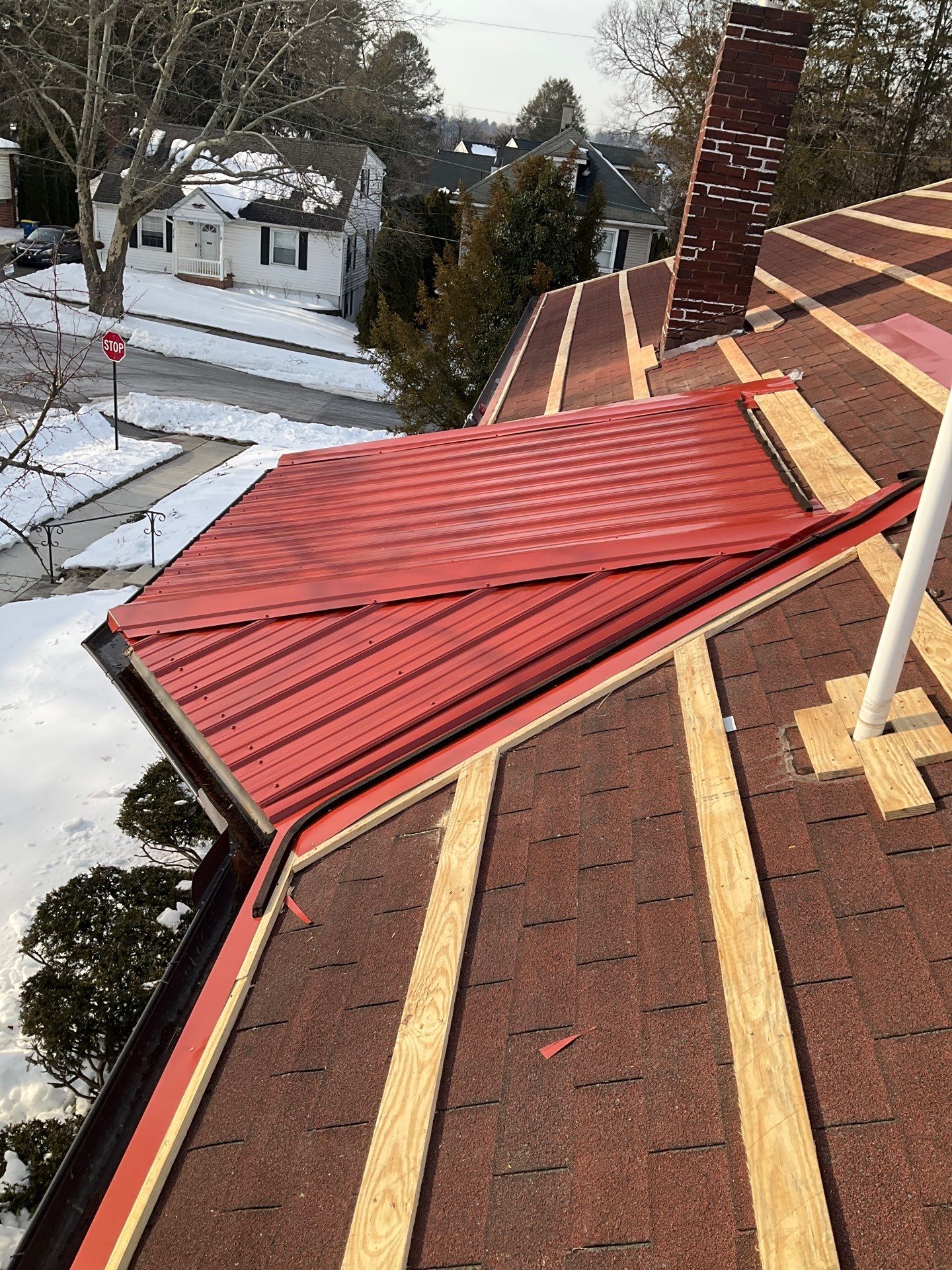 Red Metal Roofing Upgrade for Brick Home by Esh Builders
