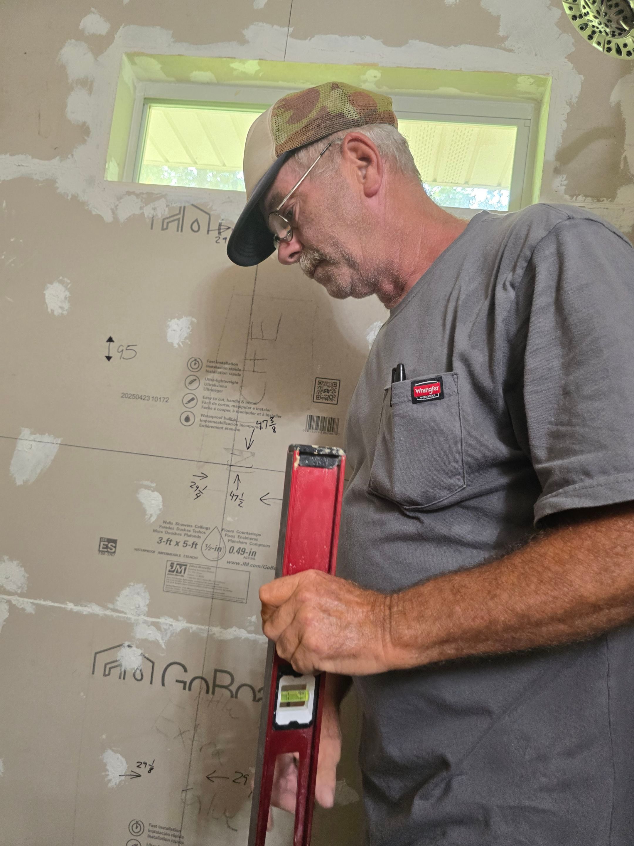 Sentrel Shower with window and ADA chair / ADA grab bar by Academy Construction