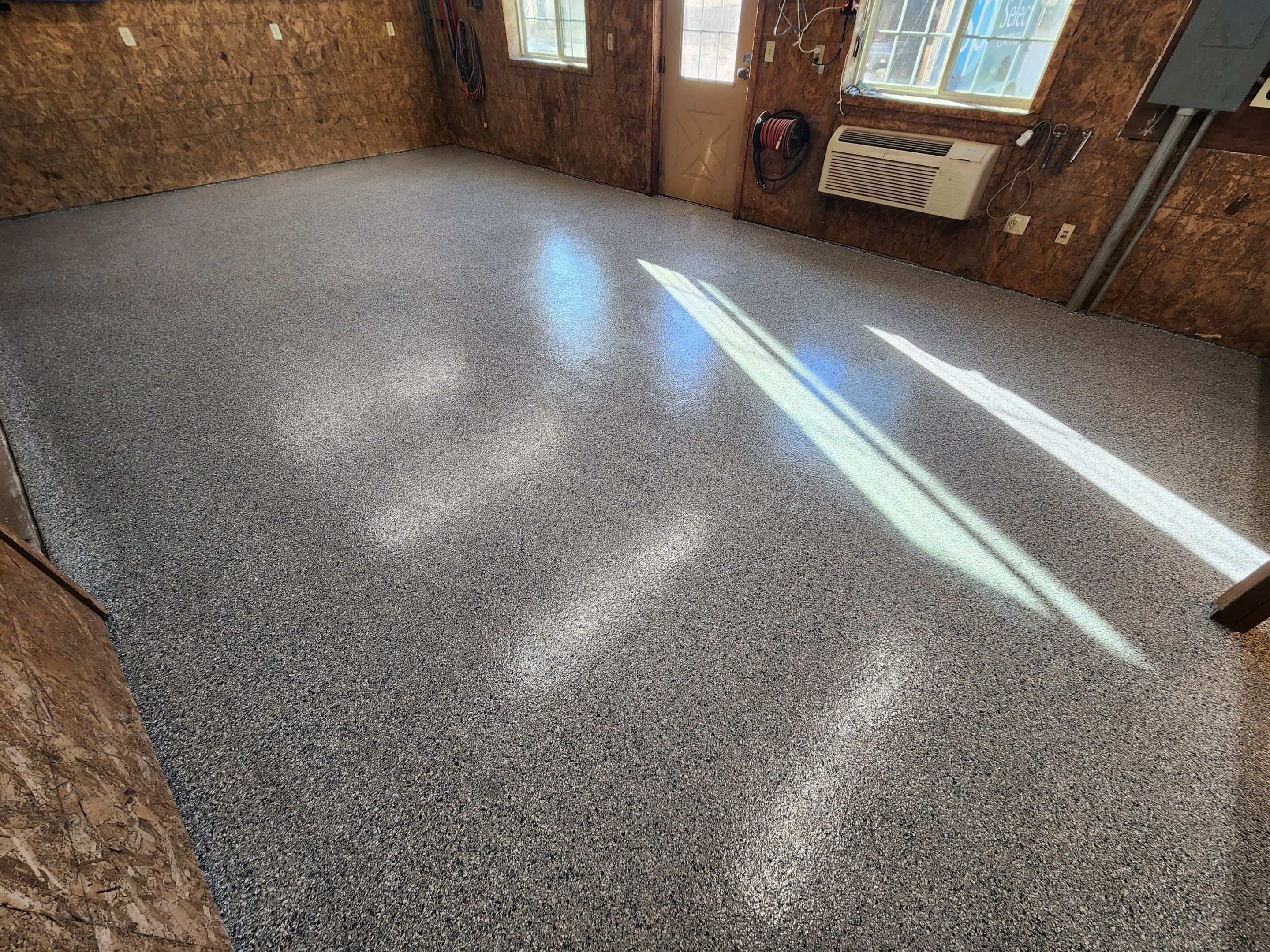 Basement using Tidalwave by Select Painting, Coatings & Garage Cabinets