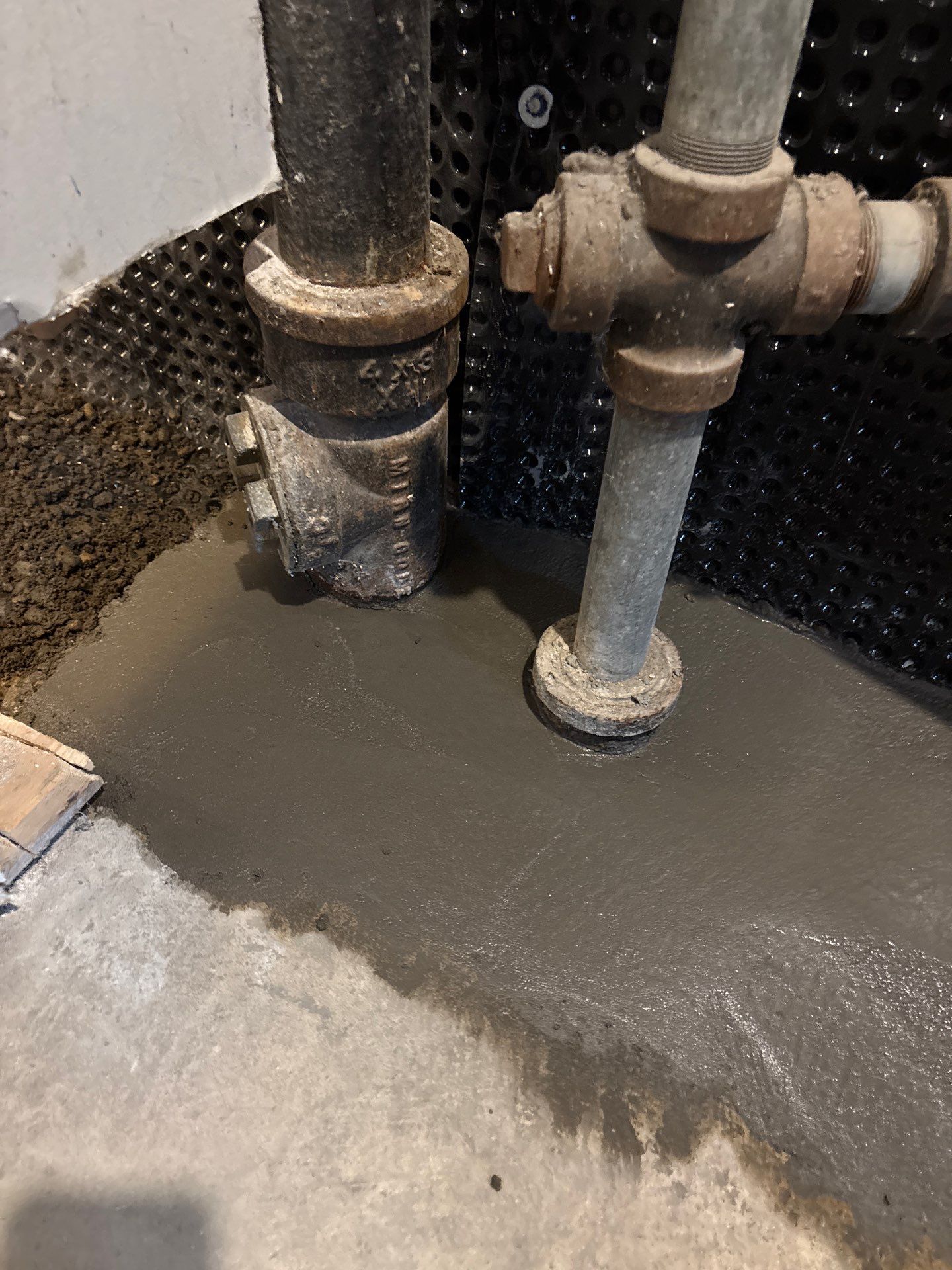 Interior Drain Tile & Buried Discharge in South Minneapolis by Waterproofing Northeast
