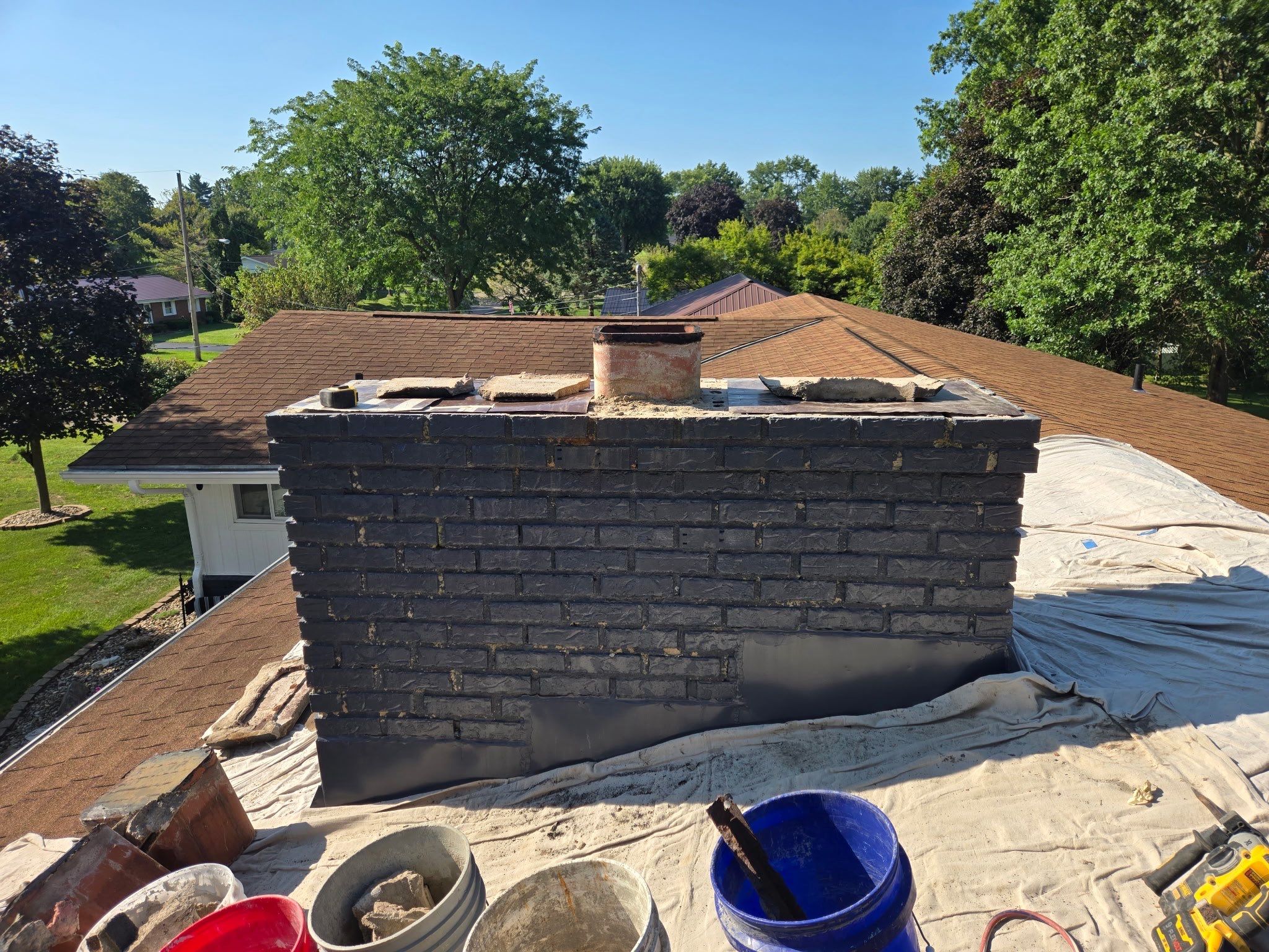 Roof Replacment, Chimney crown  by Know-A-Guy Roofing & Exteriors 