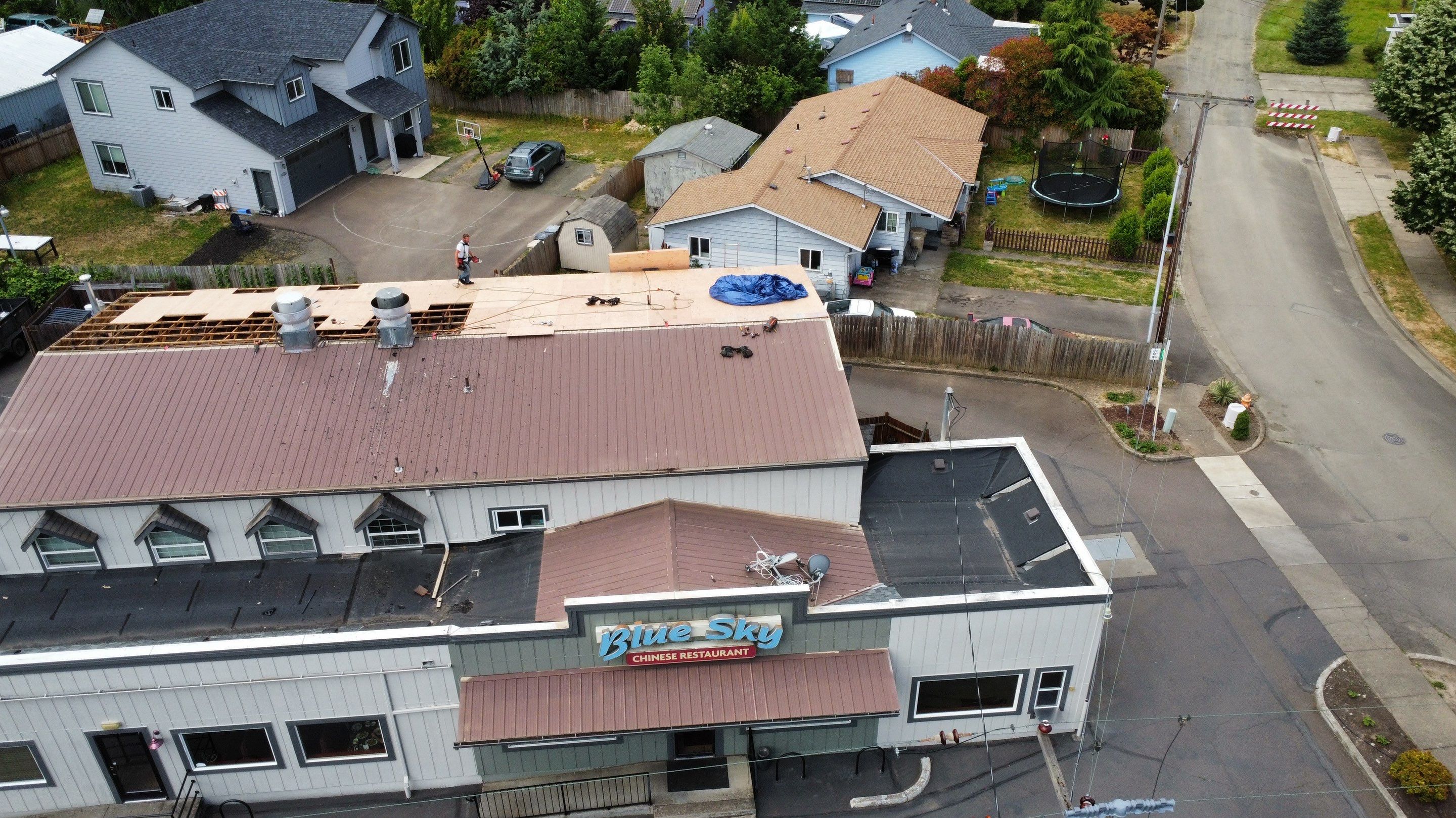 Commercial Flat Roof Installation using Bruce and Dana Snap Lock Metal (Color: Brown) by Orezona Building & Roofing Company, Inc.