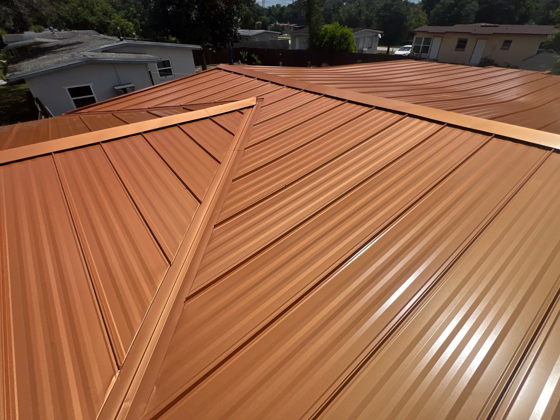 Standing Seam Metallic Copper Metal Roof Replacement in Deltona by Pinnacle Roofing Group