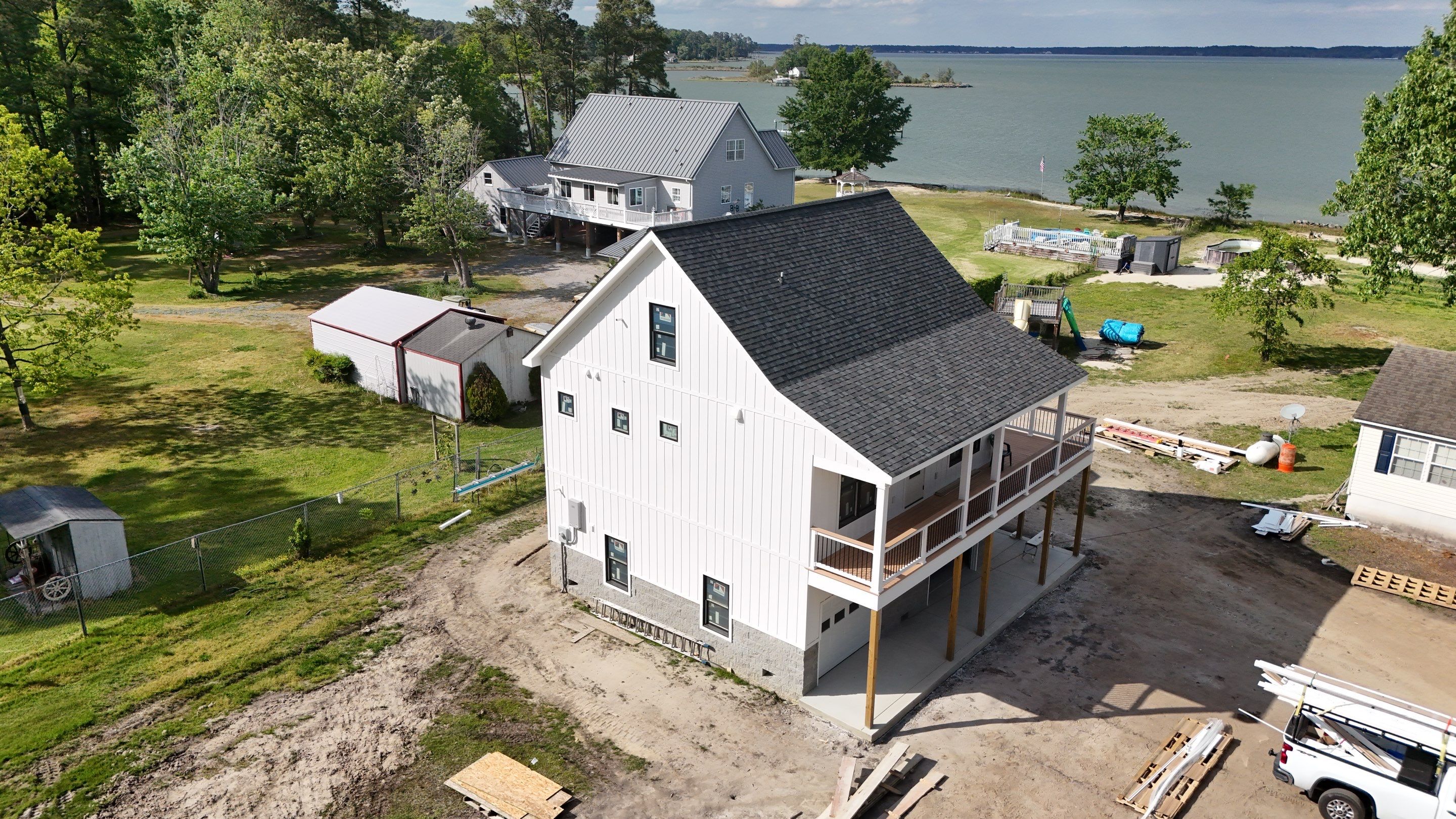 Two-Story Custom Home With Board and Batten Siding by Cade Construction