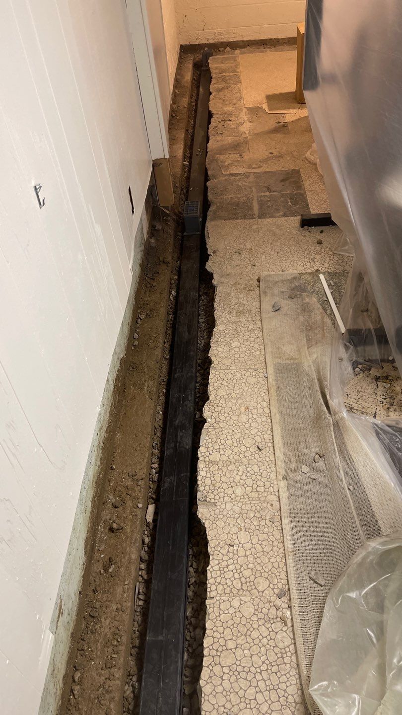 Interior Waterproofing Using GrateDrain™ Products by Toledo Basement Repair 