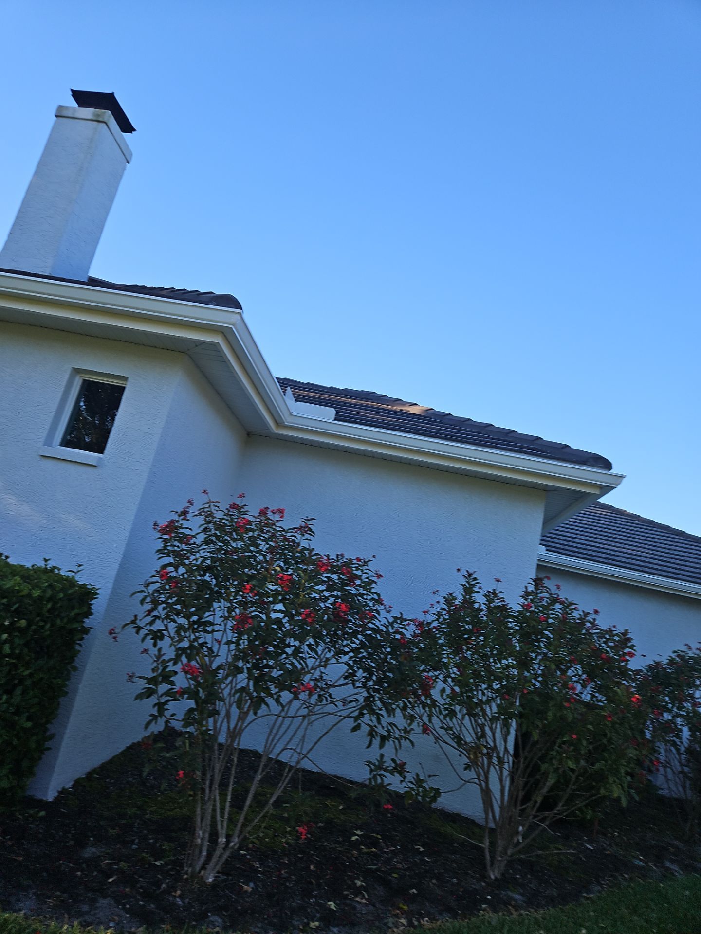 White Down Spouts using downspouts and White Seamless Gutters in Sarasota FL by Gutter Professors