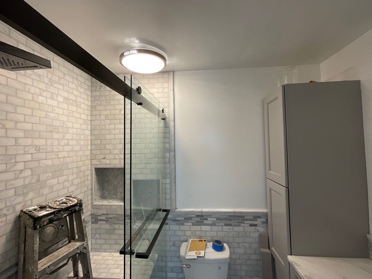 Bathroom Remodel using Two new bathroom design and new floors by Alpha Design Services