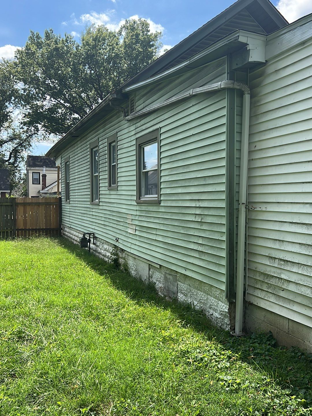 Rental Property Restoration, siding, flooring, gutters, landscaping by Storm Contracting 