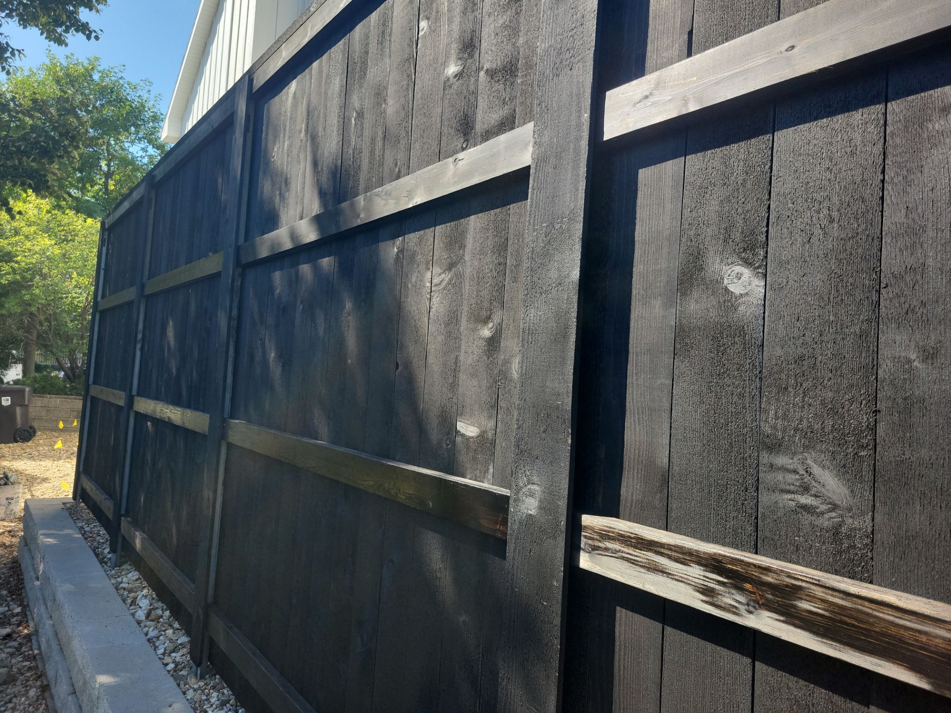 Black Wood Privacy Fence in Cedar Falls by Perfect Picket Fence and Stain