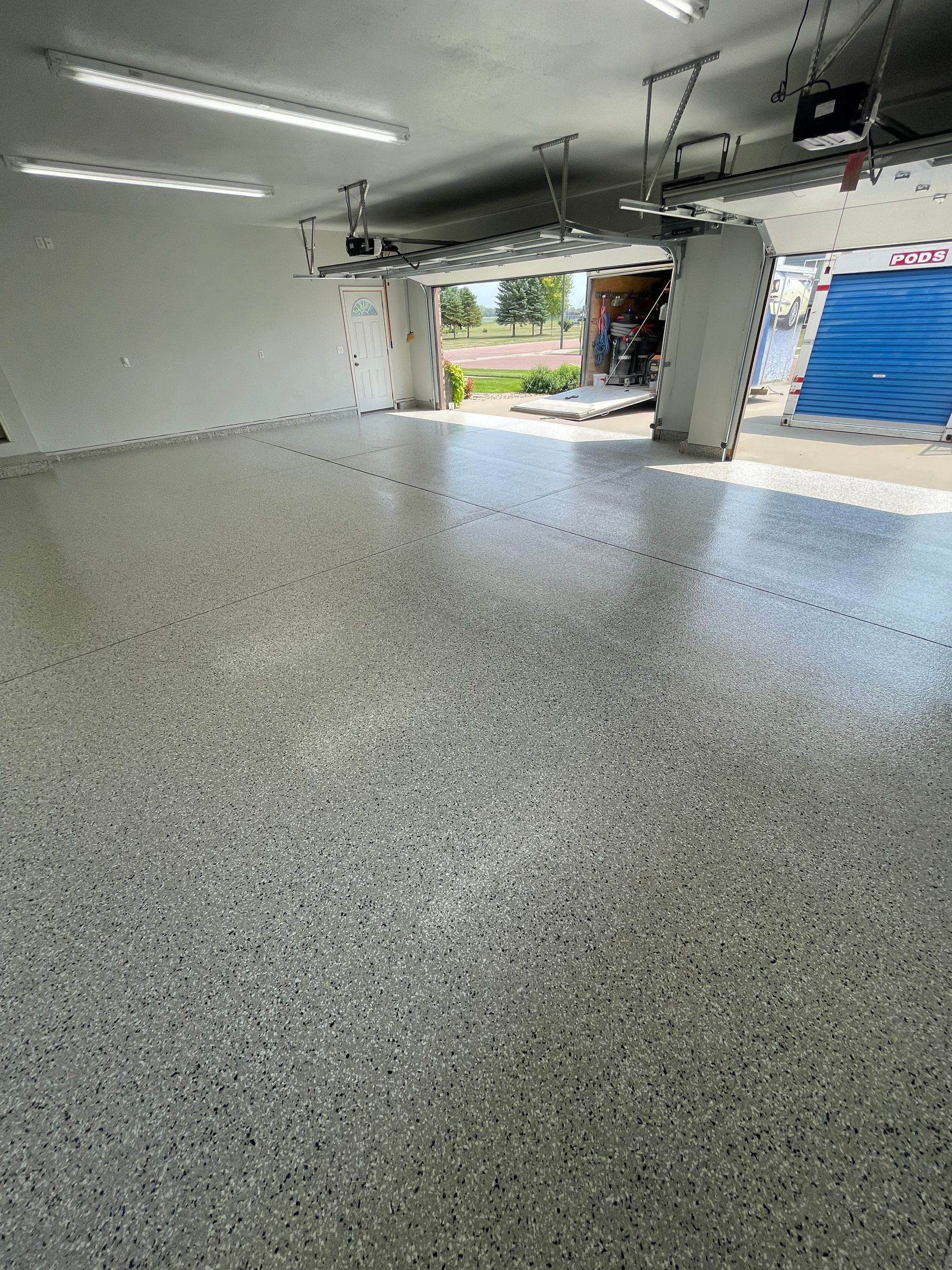 Multi-Car Garage Floor Coating and Crack Repair in Tea by Select Painting, Coatings & Garage Cabinets
