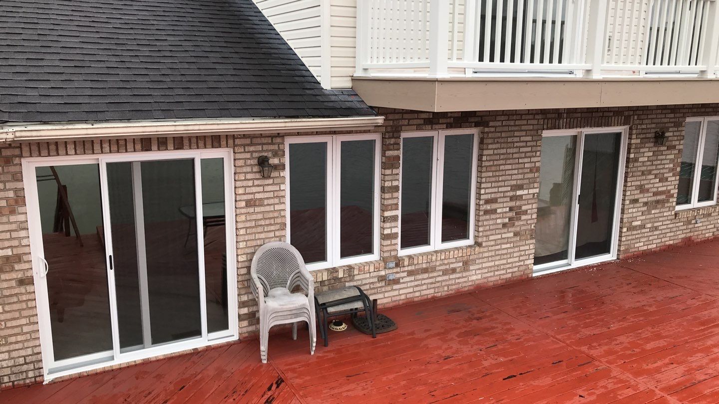 Deck Refurbush and Door Replacement using Trex Decking and Railing. Polaris Patio Doors by Secure Construction Company Inc