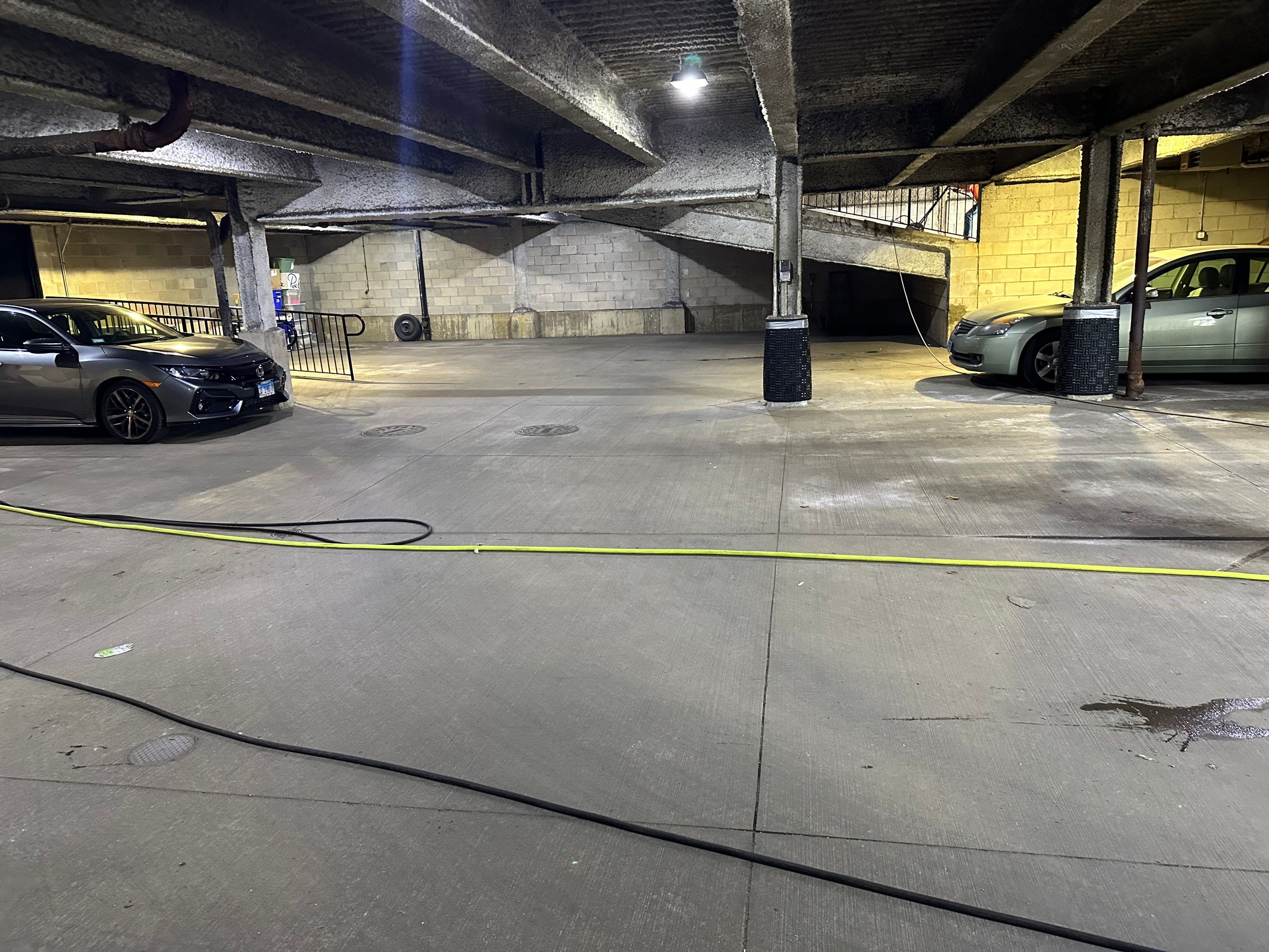 Parking garage cleaning using Hot water by Northern Power Washing LLC.