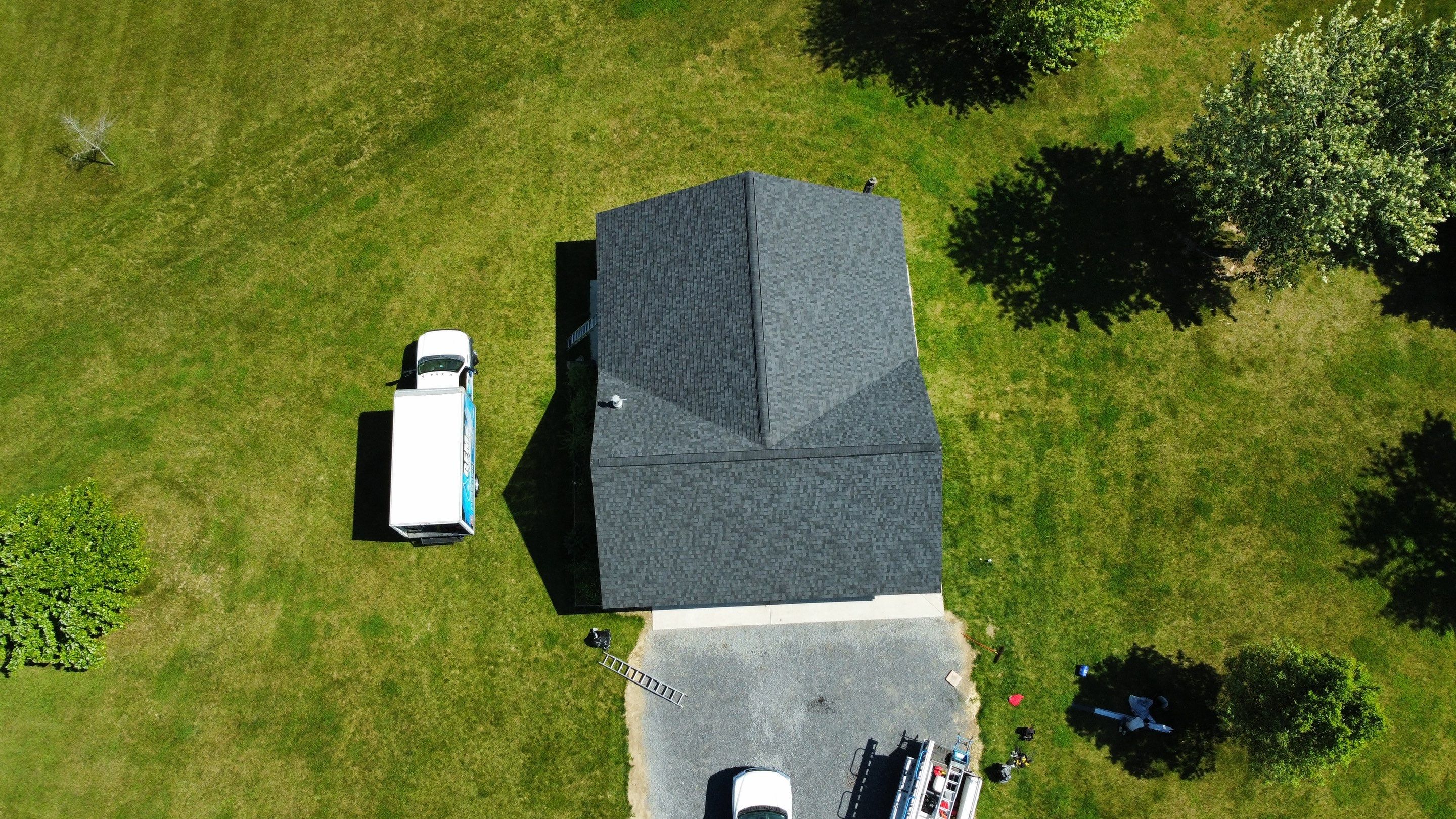 Roof Damage using Certainteed Lifetime Roofing System- Moire Black Landmark Pro shingkes with shadow ridge caps. by BulletpROOF Exteriors