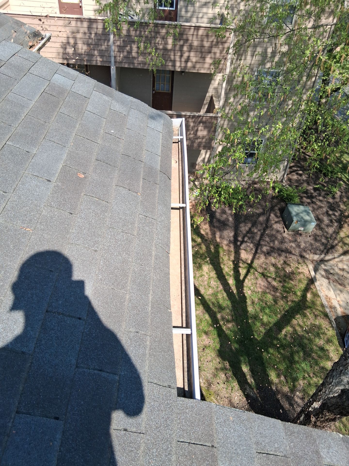 HOA gutter cleaning in Mooresville & Lake Norman, NC, after  photo showing full gutters.