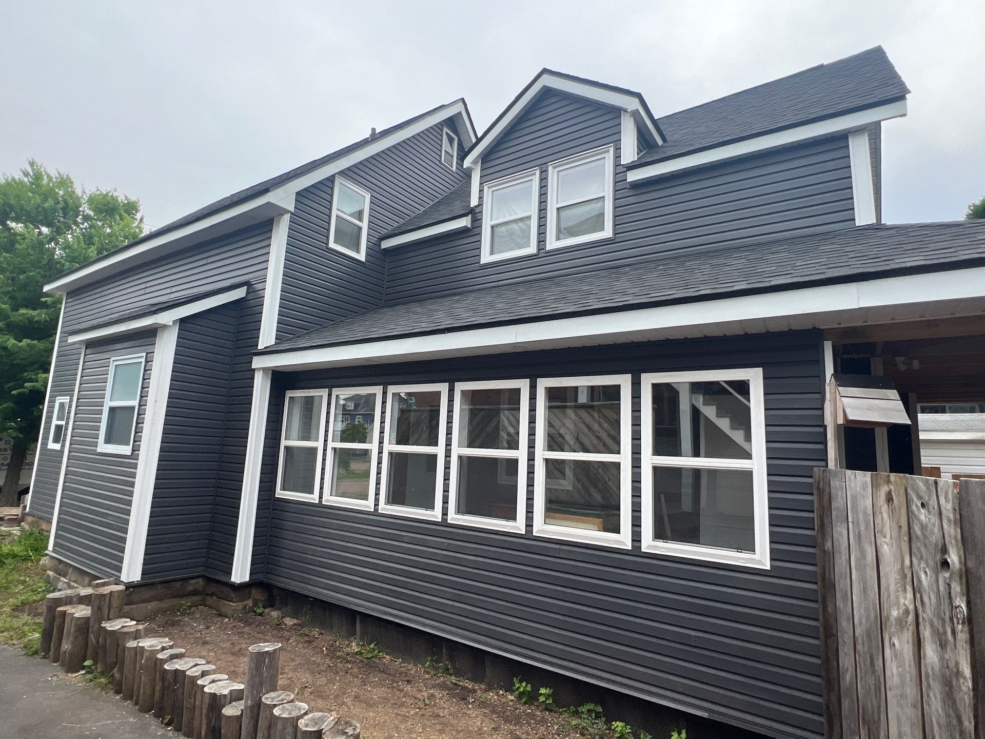 Exterior Renovation using New Roofing and Siding by Bobby Built