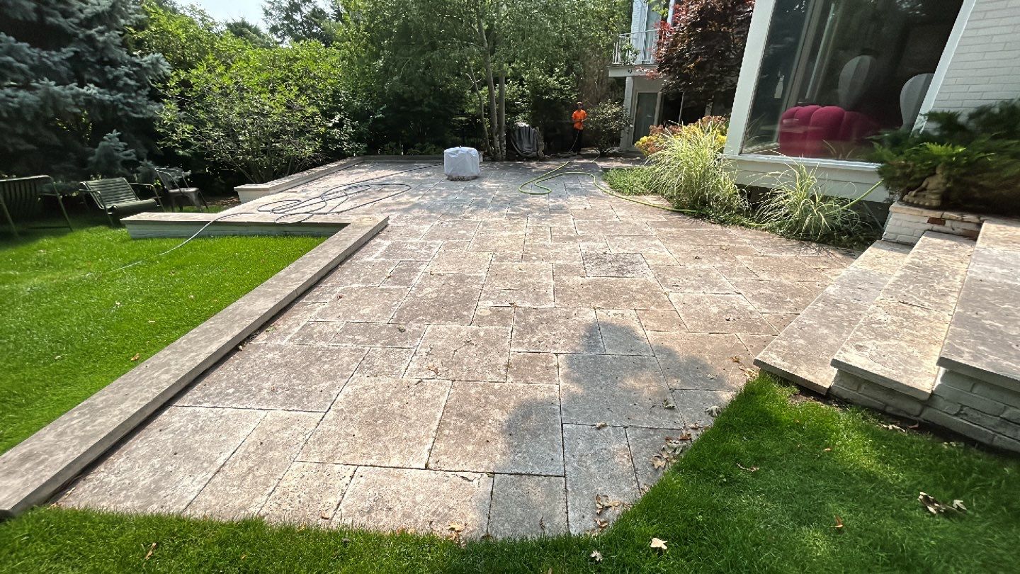 marble patio cleaning and sanding using Polysweep polymeric sand by Northern Power Washing LLC.