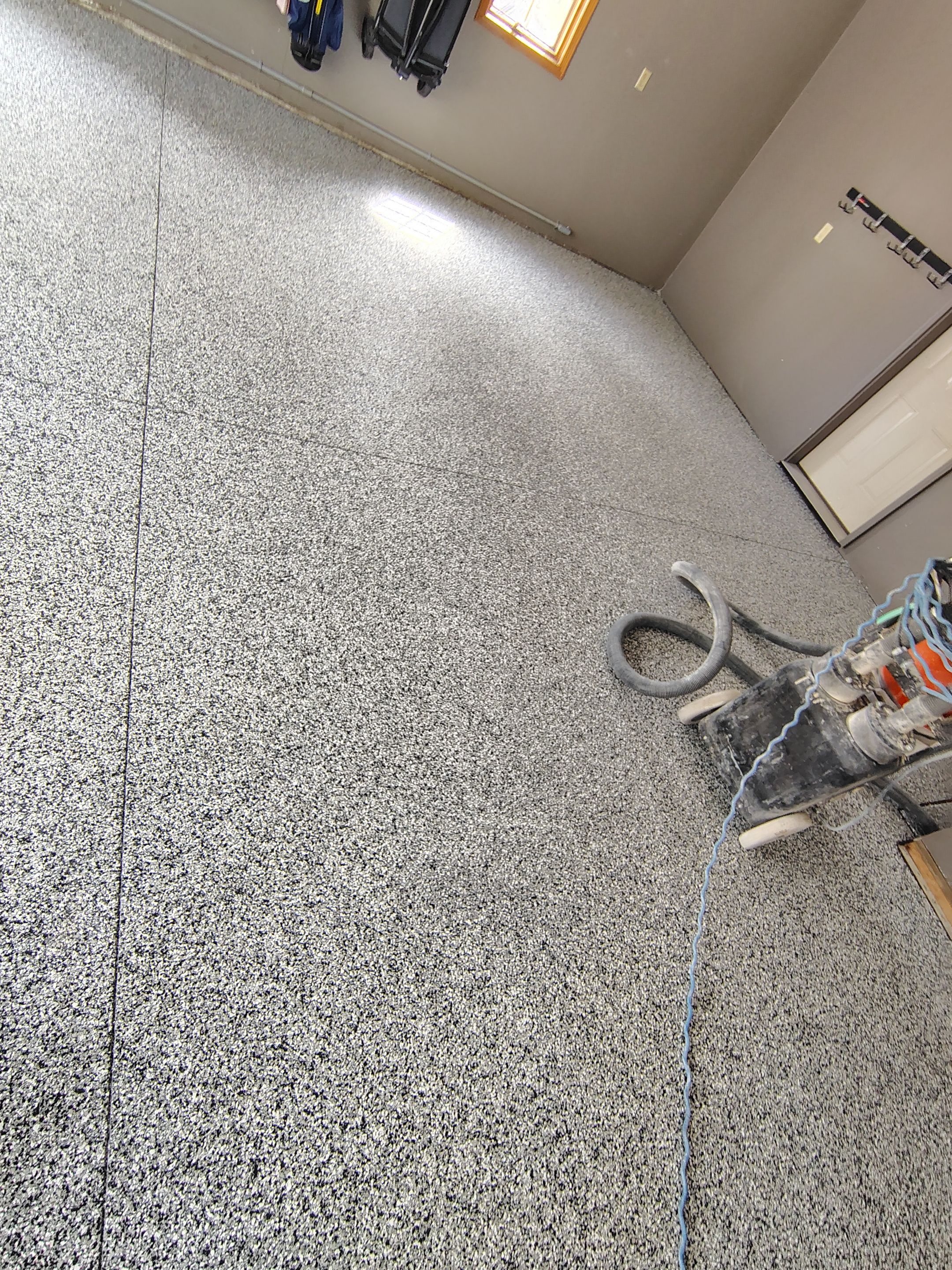 Garage Floor Concrete Coating and Crack Repair in Sioux Falls by Select Painting, Coatings & Garage Cabinets