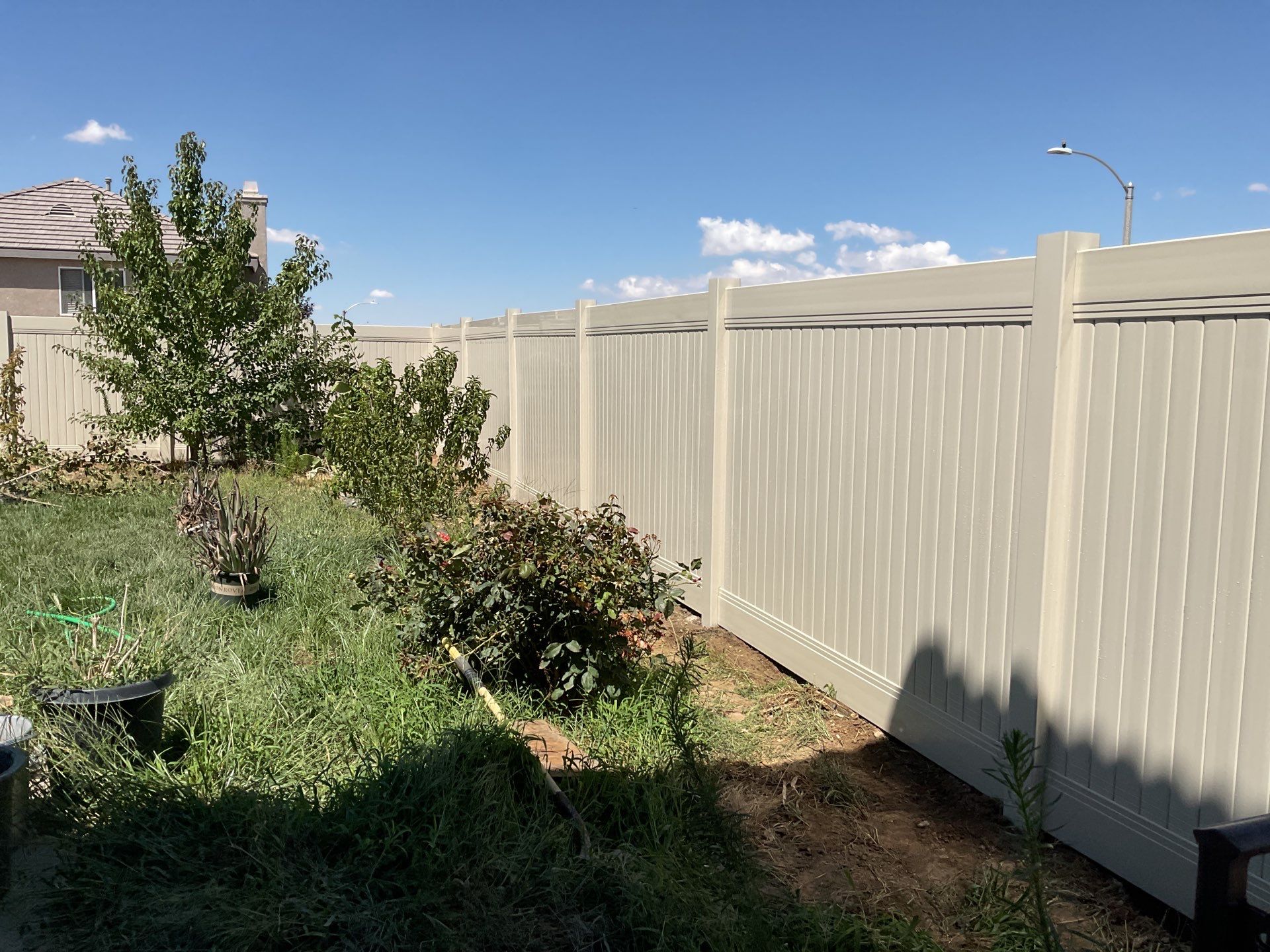 Tan Vinyl by Fence Guys Inc. 