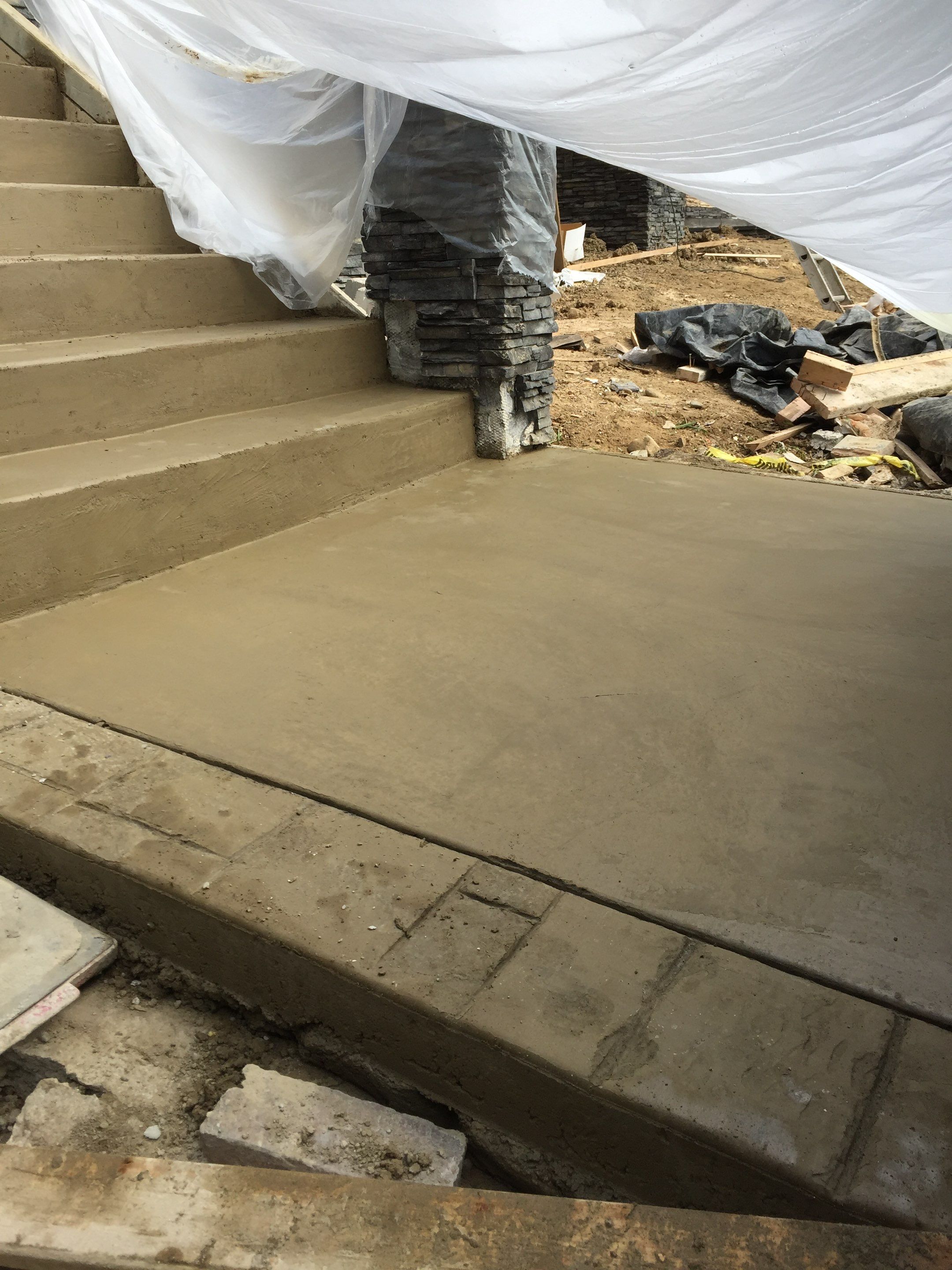 Asphalt Driveway and Stamped Concrete Patio Finish  by Jireh Asphalt & Concrete Inc 