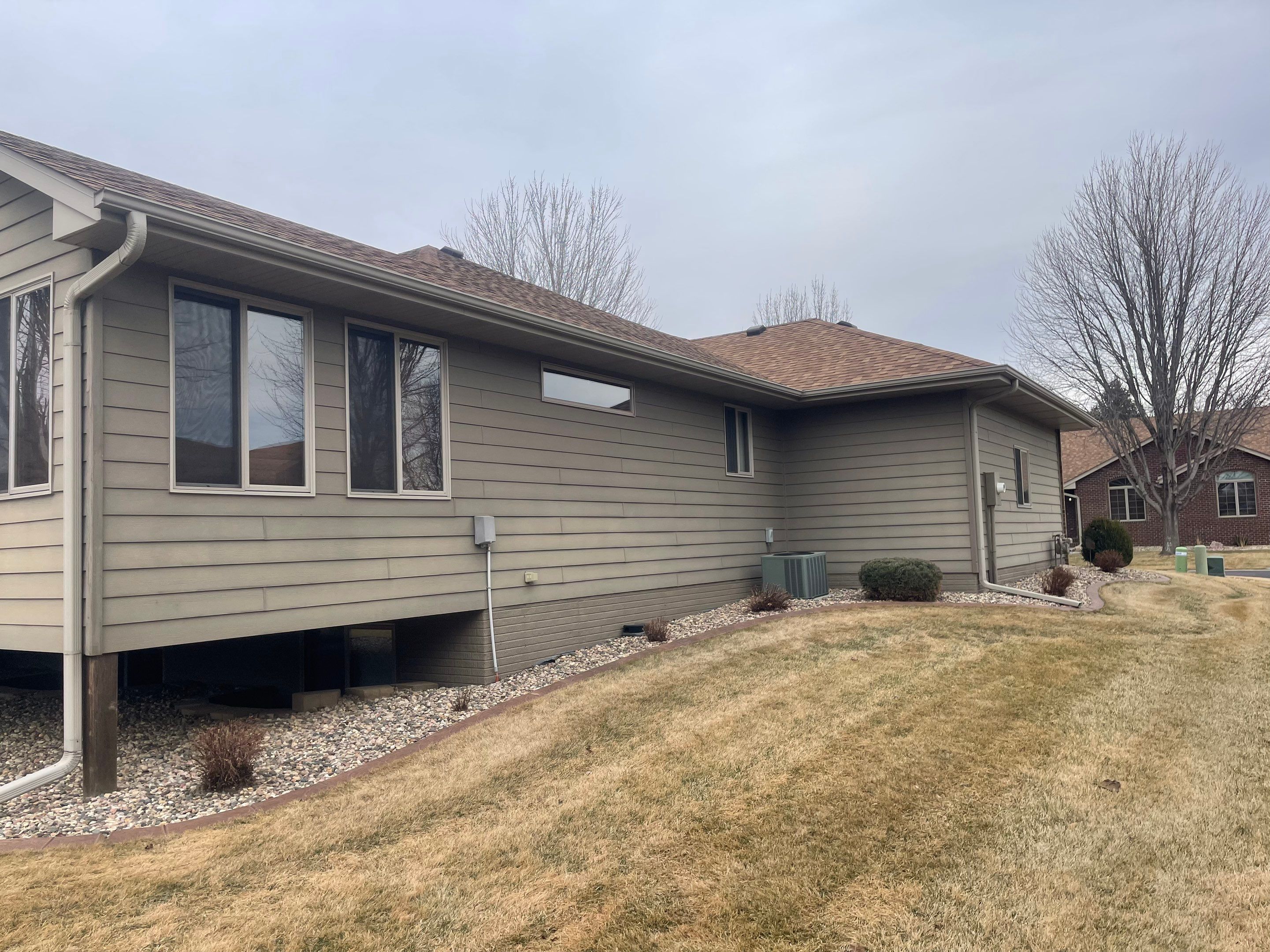 Residential Exterior Siding and Trim Painting in Sioux Falls by Select Painting, Coatings & Garage Cabinets