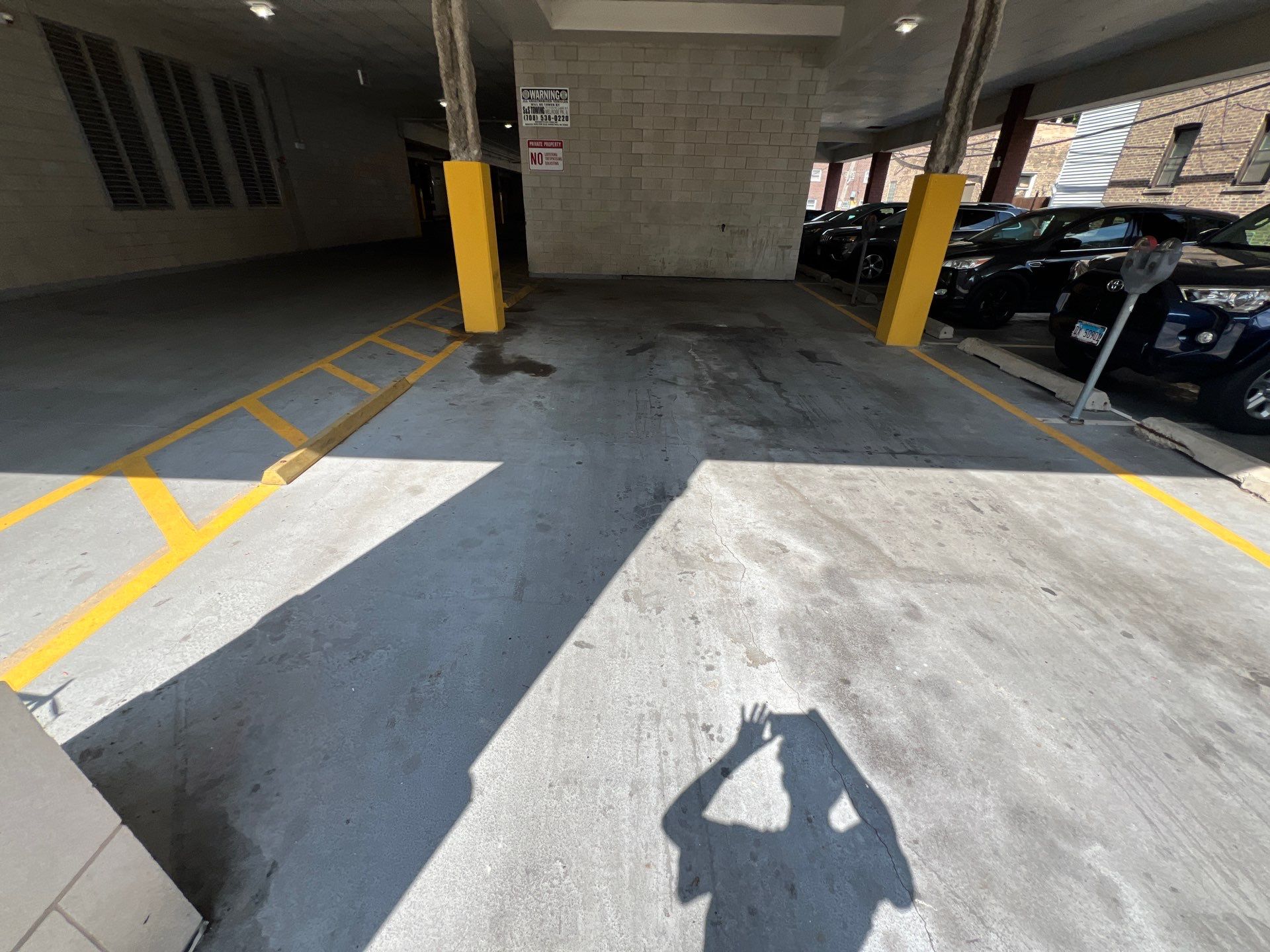 Parking garage using Hot water by Northern Power Washing LLC.