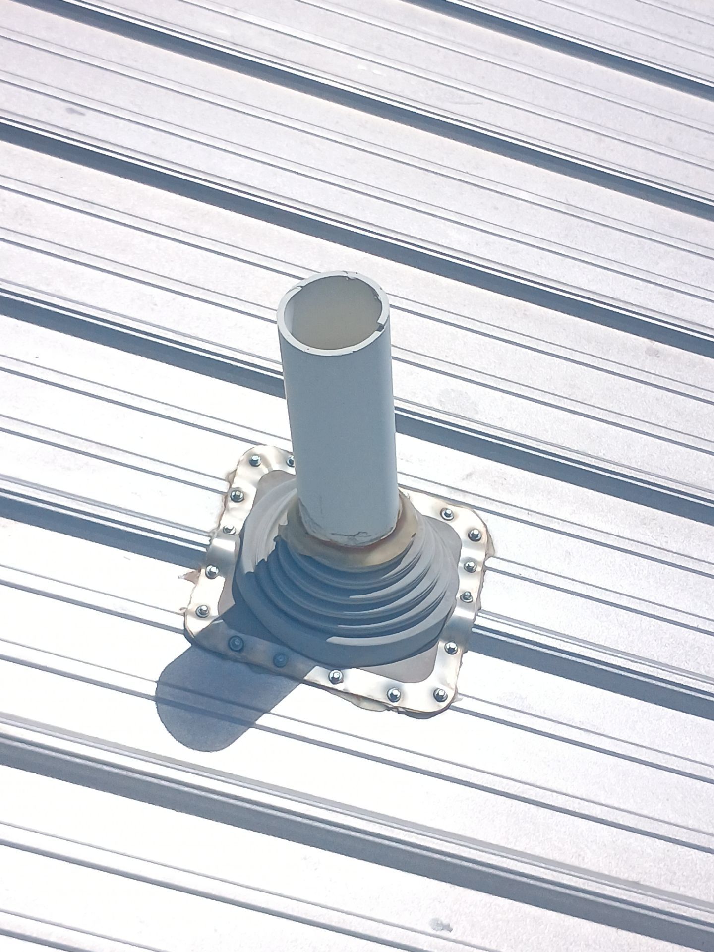 Corrugated Metal Roof Repair for Brick Home in Lindsay by BANA Roofing and Solar Supply