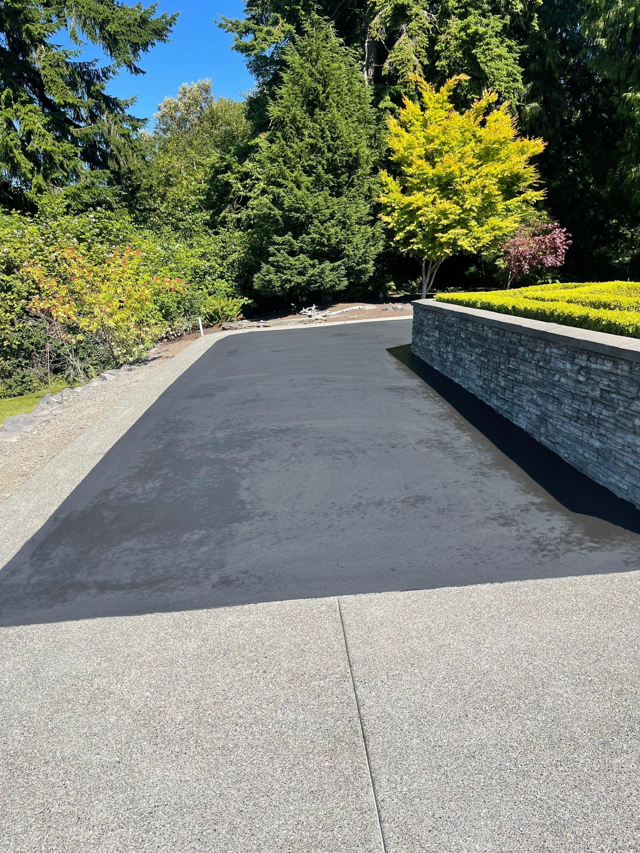 Concrete Driveway Makeover w/ Asphalt Patch | Everett  by Jireh Asphalt & Concrete Inc 