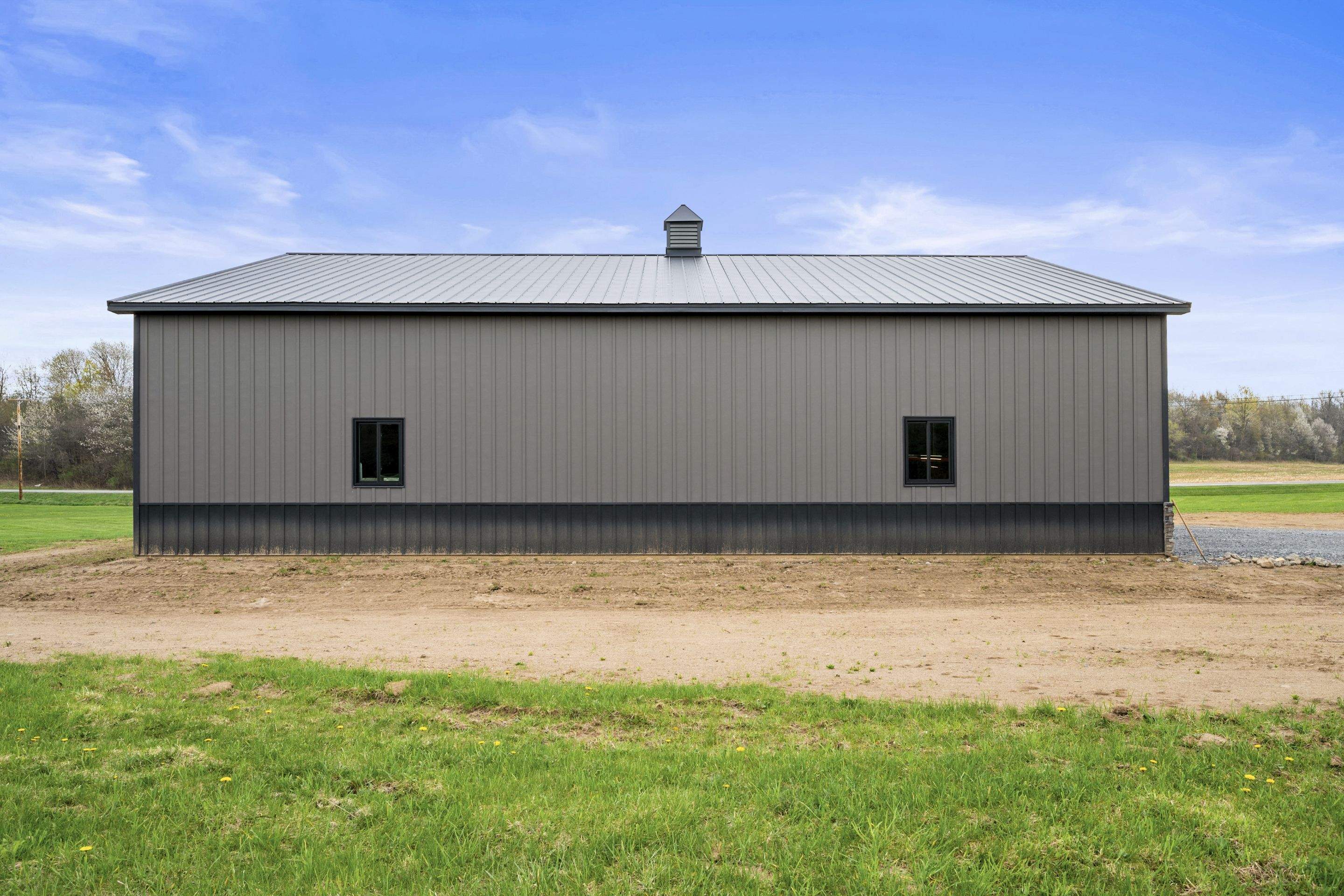 Barndominium  using Textured Board & Batton by Horst Custom Homes 