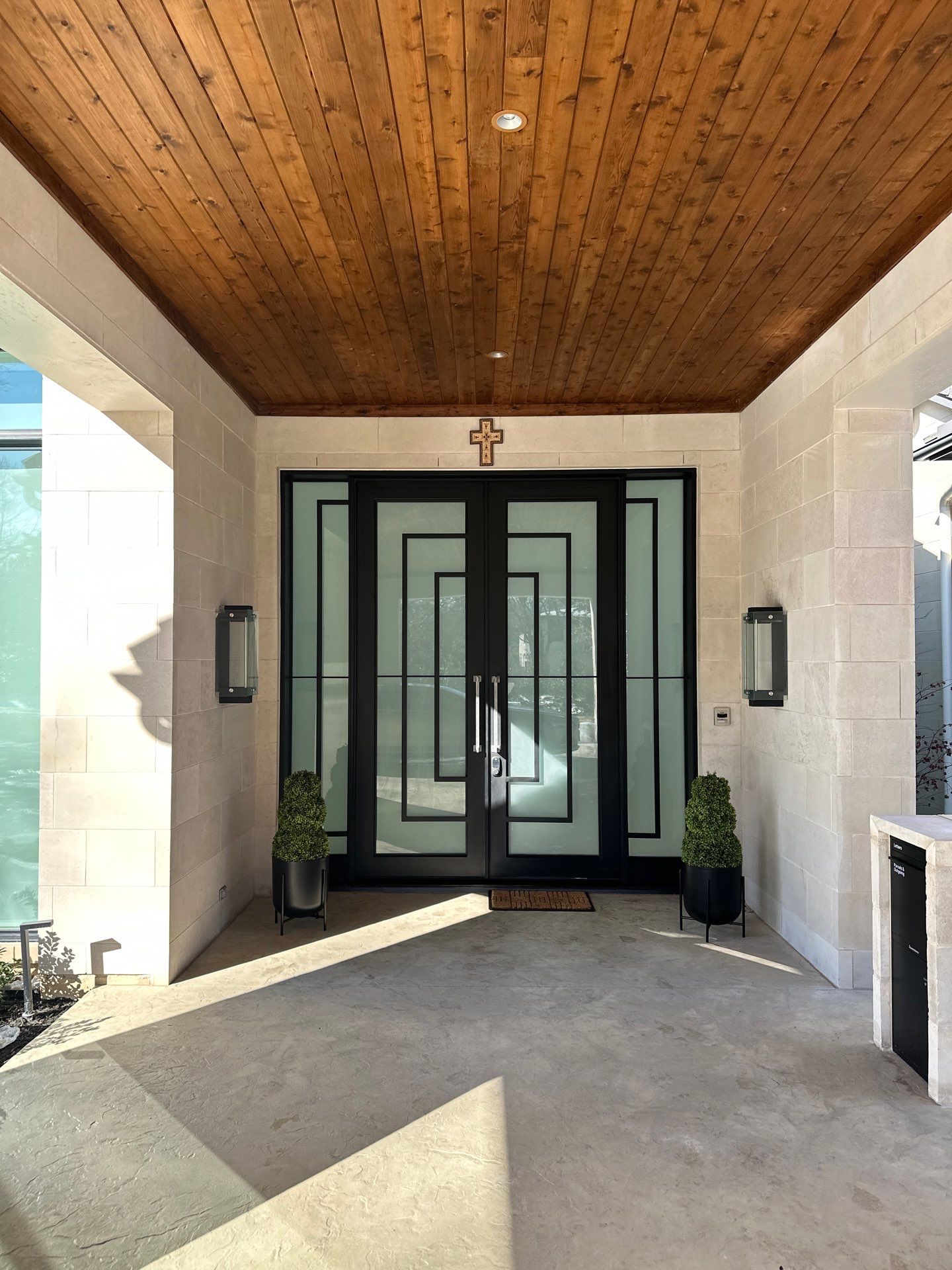 Modern Metal and Glass Entryway Installation with Custom Hardware Finishing in Dallas by Solara Custom Living