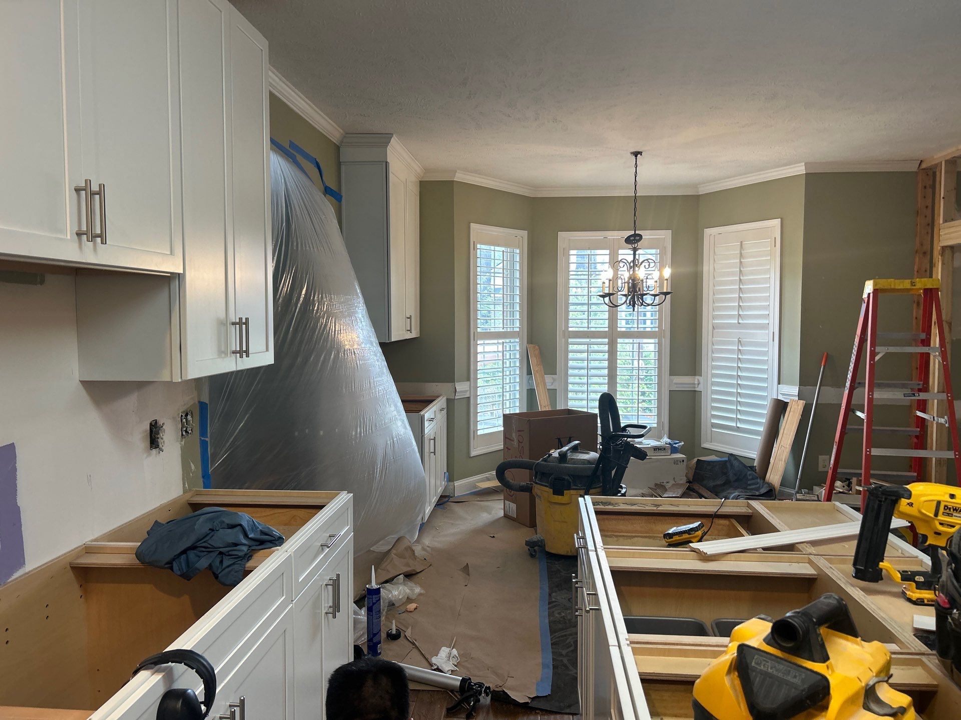 Complete Kitchen Renovation Featuring White Shaker Cabinetry in Fayetteville by Karcher Roofing & Construction