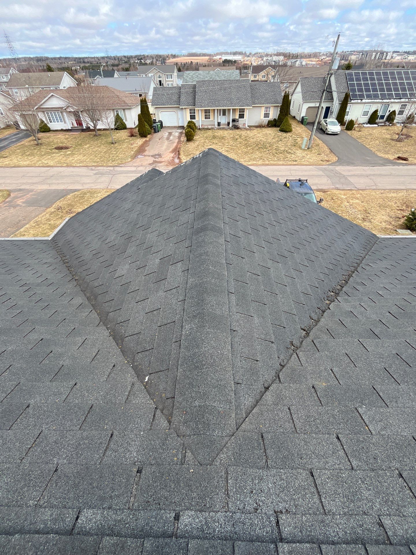 Residential Roofing Installation using Asphalt GAF HDZ in Charcoal by Artisan Roofing & Home Improvements Inc.