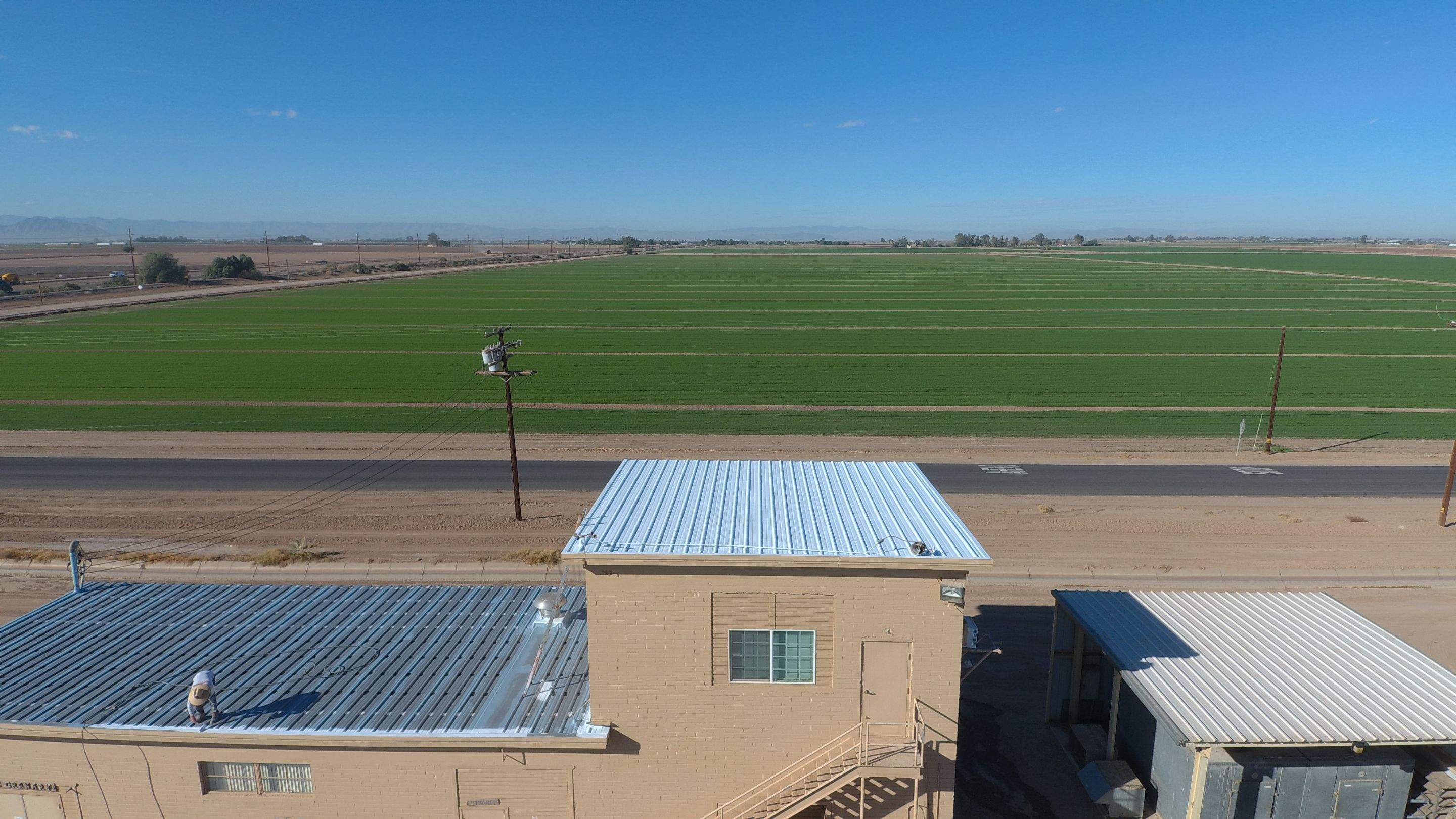 Metal roof restoration on commercial roof using Conklin Benchmark/PUMA XL fabric and coating by Straight Edge Roofing Inc