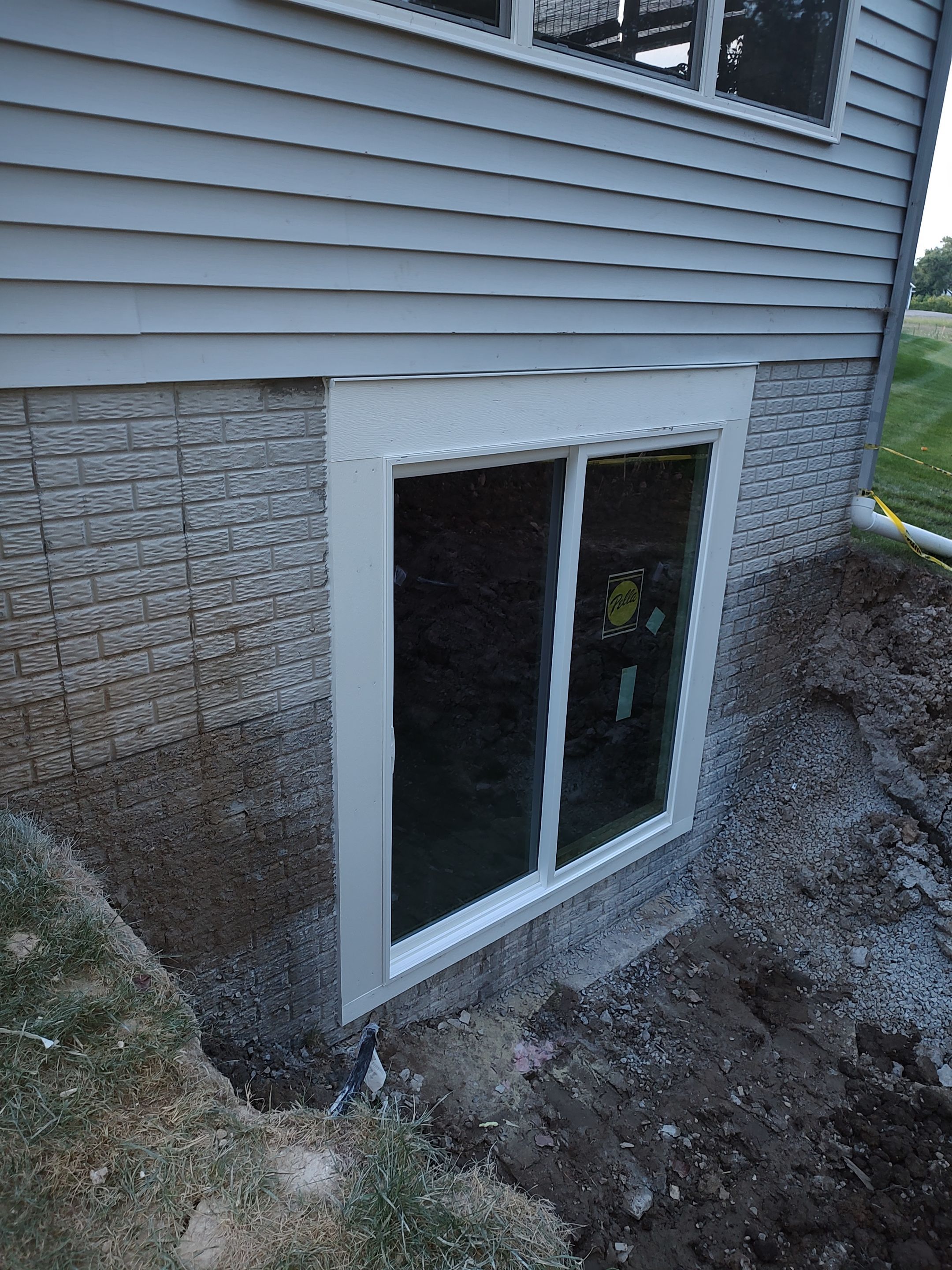 Egress Door Install using Egress Sliding Walk-Out Basement Door by Toledo Basement Repair