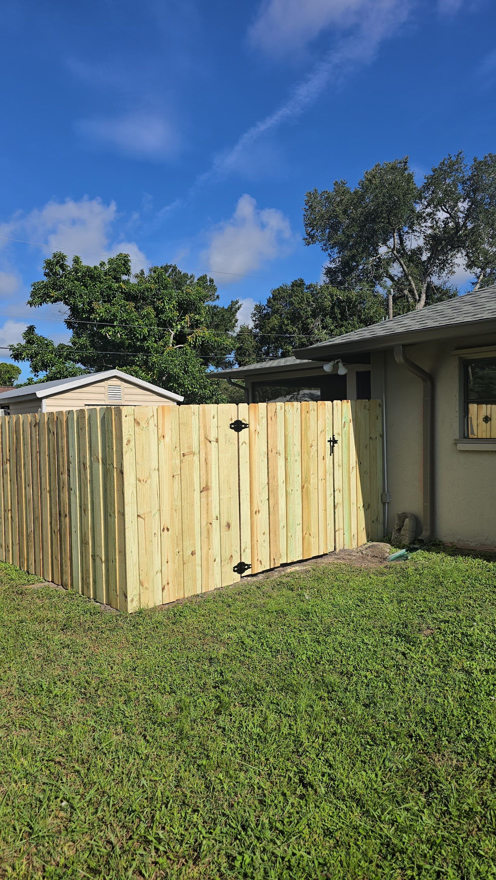 Pressure-Treated Wood Privacy Fence and Gate Installation in North Port by True Fence LLC
