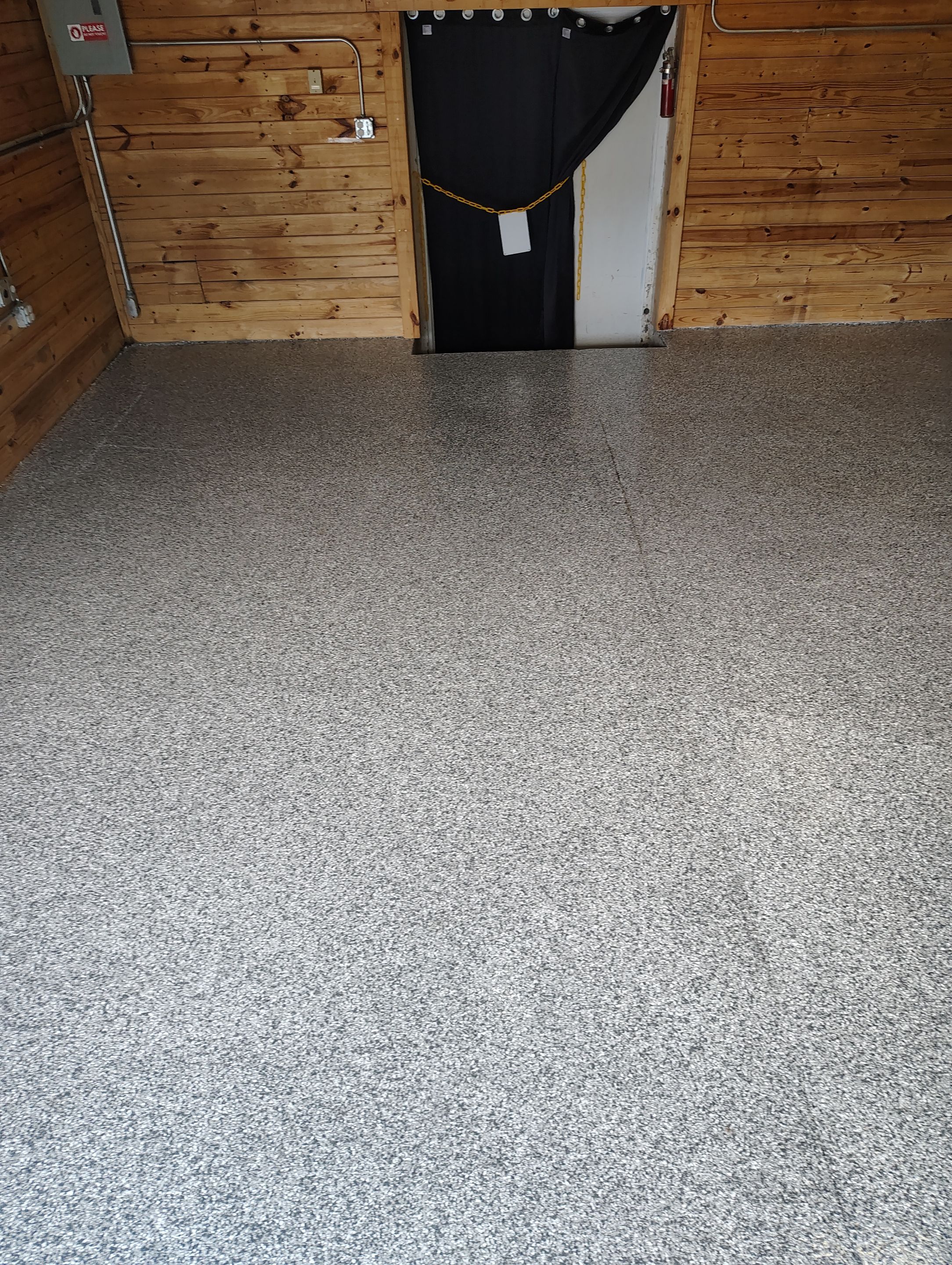 Commercial Epoxy Flake Floor Coating in Emmetsburg, Iowa by Select Painting, Coatings & Garage Cabinets