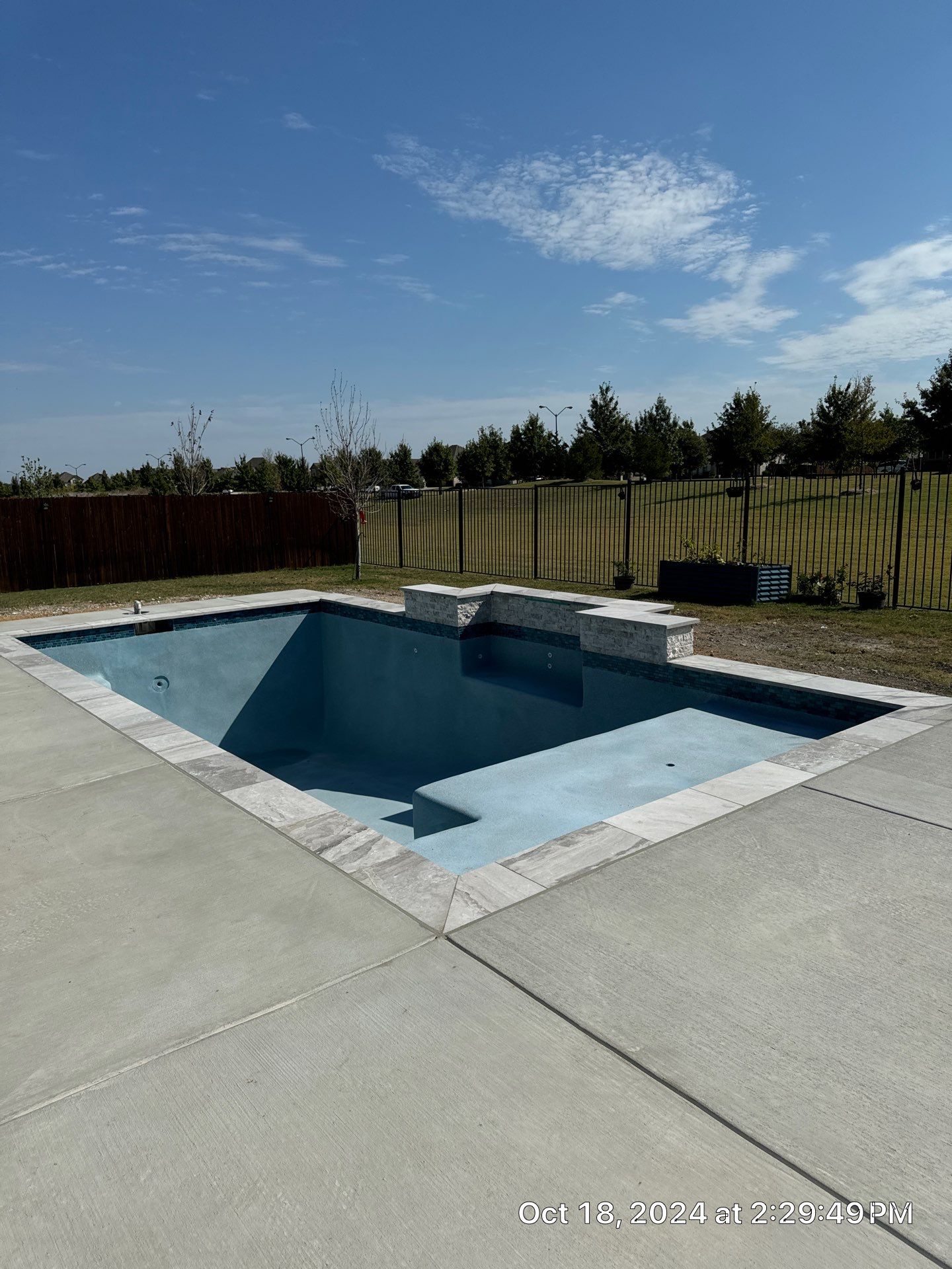 Modern Geometric Pool with Expansive Deck by Pinnacle Pools and Spas - DFW