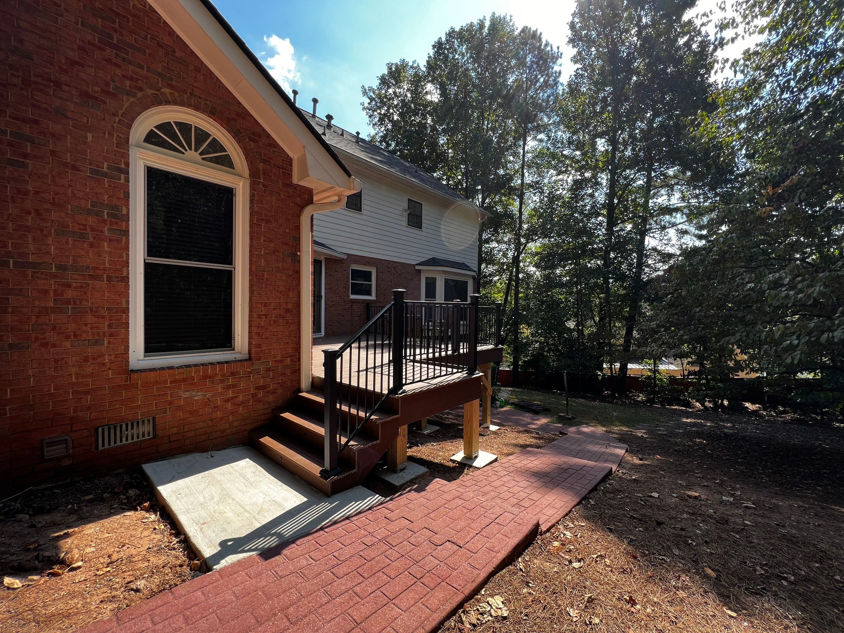 Elevated Composite Deck Installation with Metal Railings in Atlanta by Swift Home Renovations