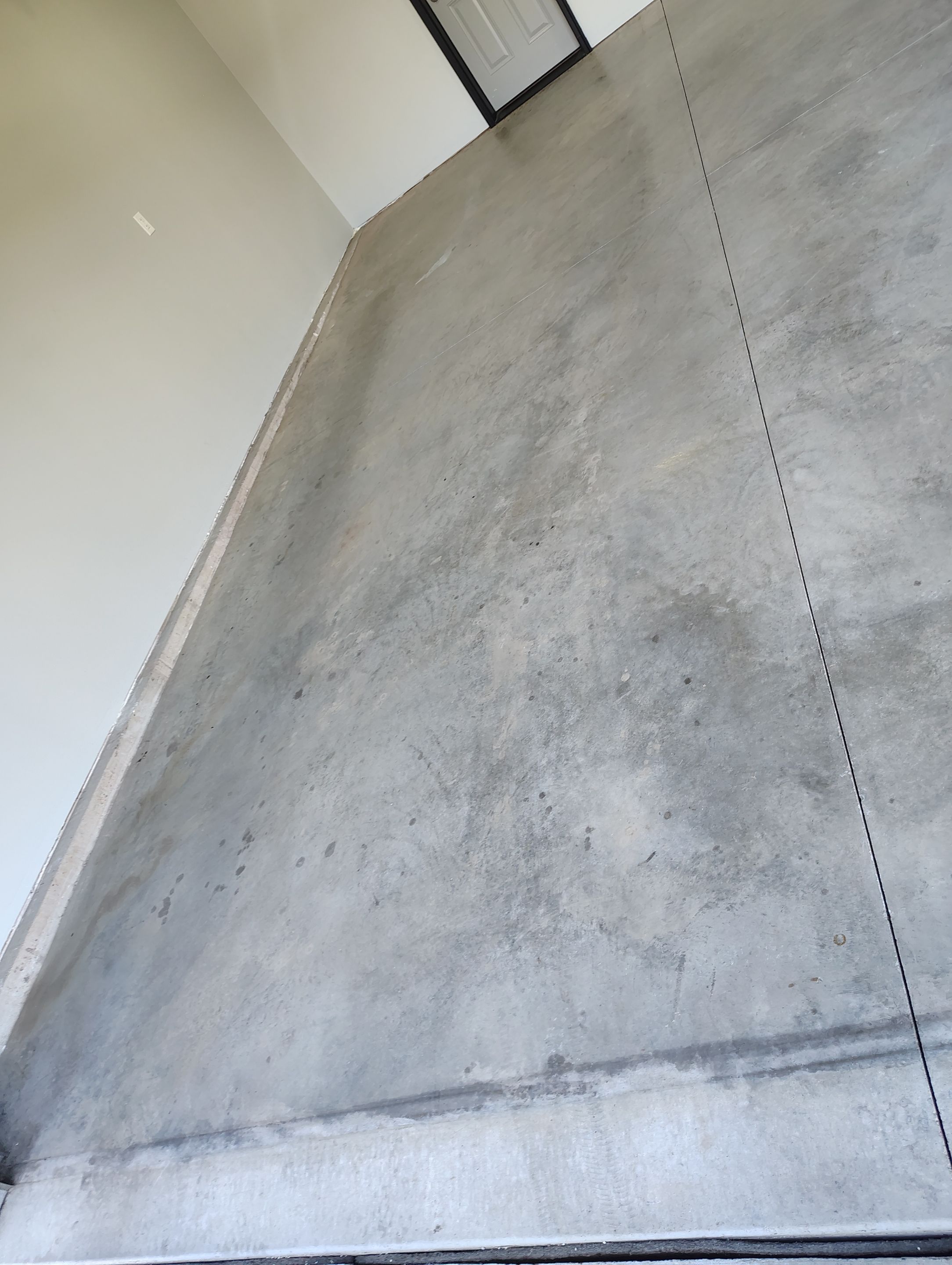 Custom Epoxy Garage Floor Coating Installation in Sioux Falls by Select Painting, Coatings & Garage Cabinets