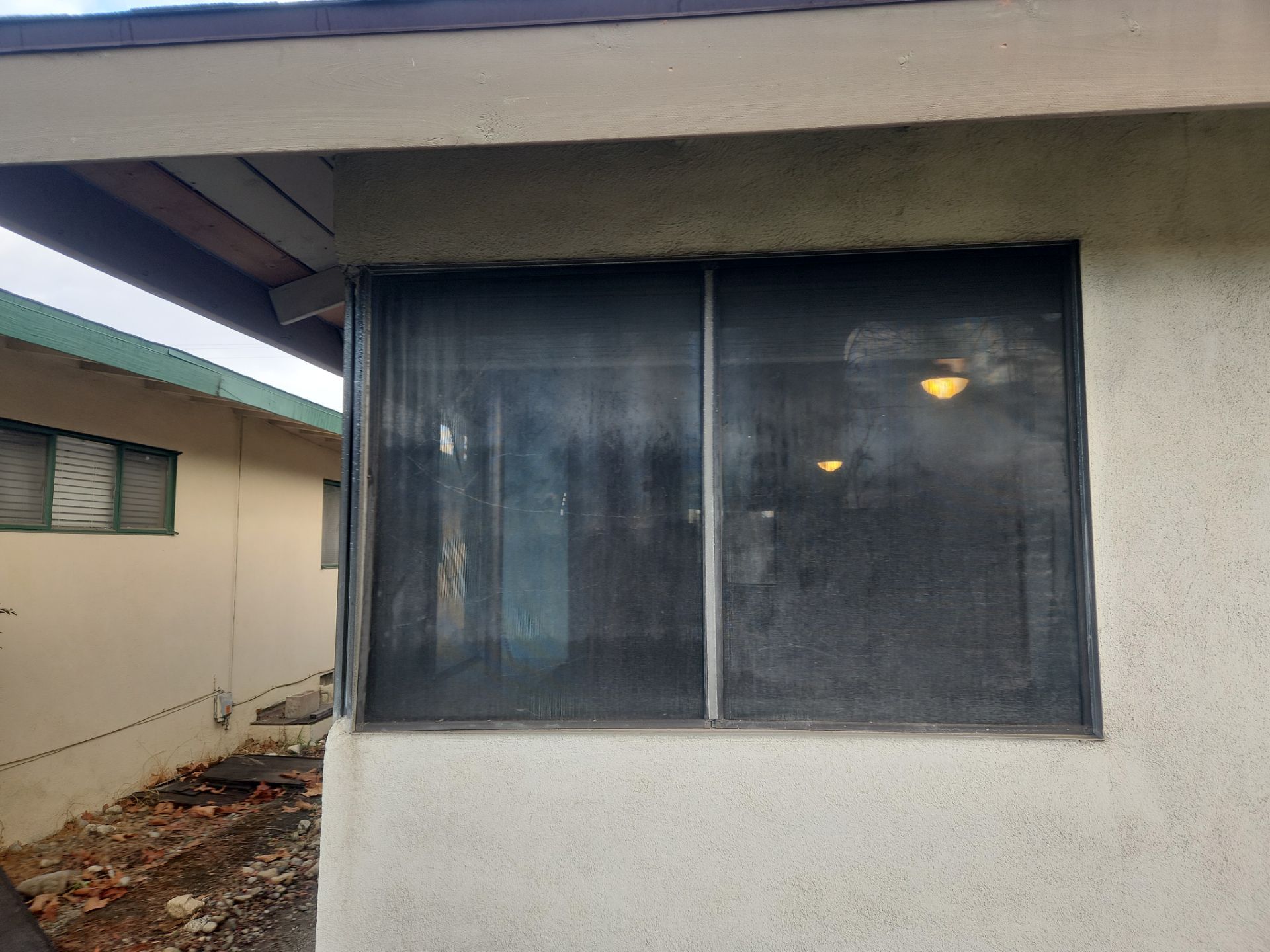 Window Installation using Black Vinyl Windows by American Window Company