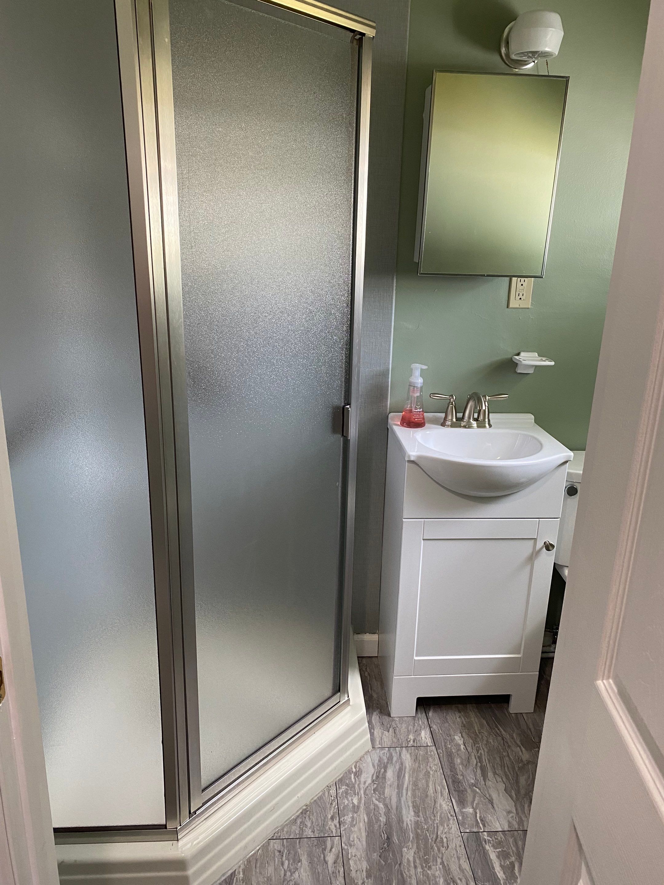 Bathroom Remodel using BCI Acrylic Shower System by Secure Construction Company Inc