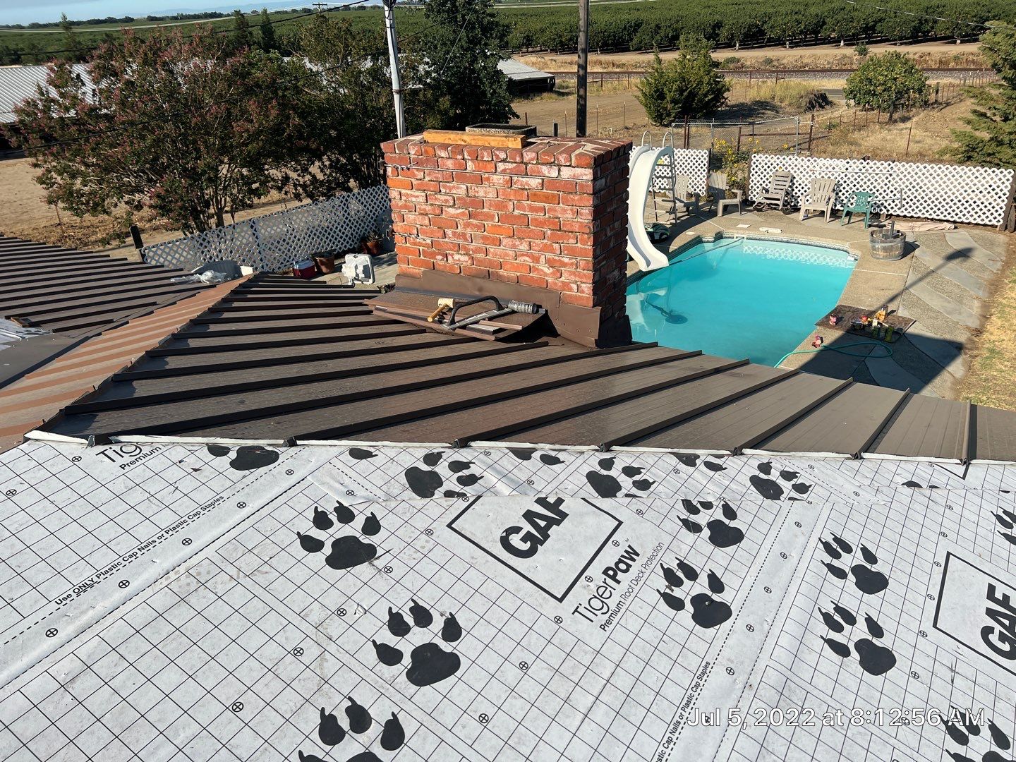Metal roofing installation using Standing seam metal roofing system by Straight Edge Roofing Inc