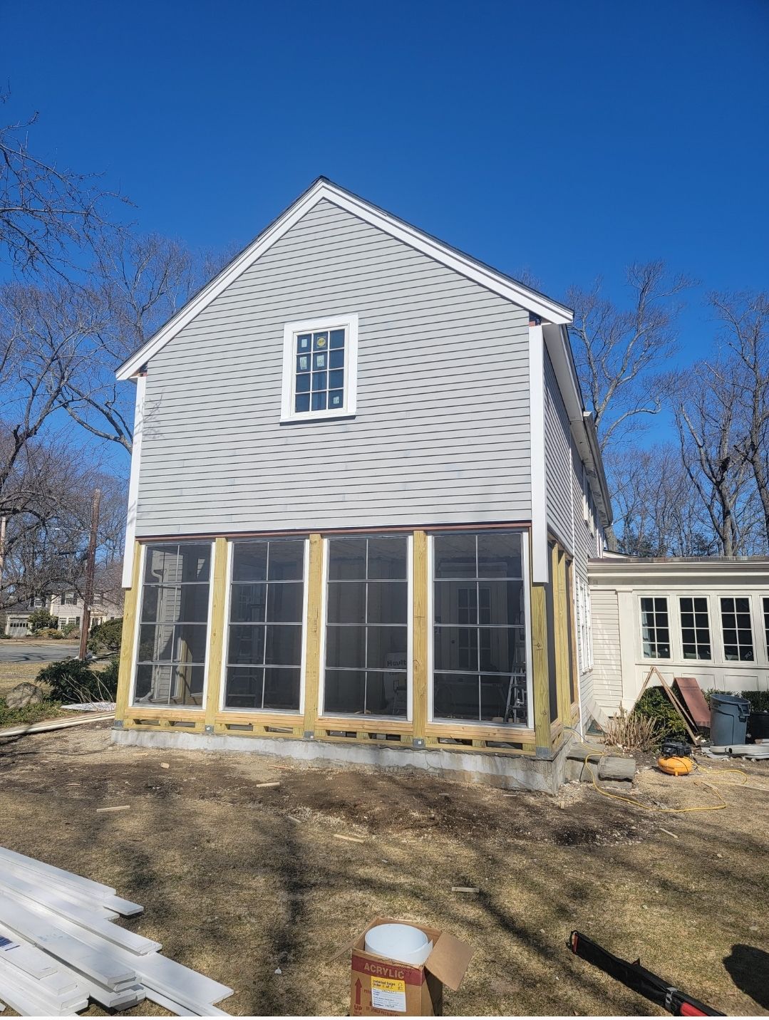 Wood Clapboards and vinyl Slate roof with new Pella windows in Wellesley. by UBrothers Construction
