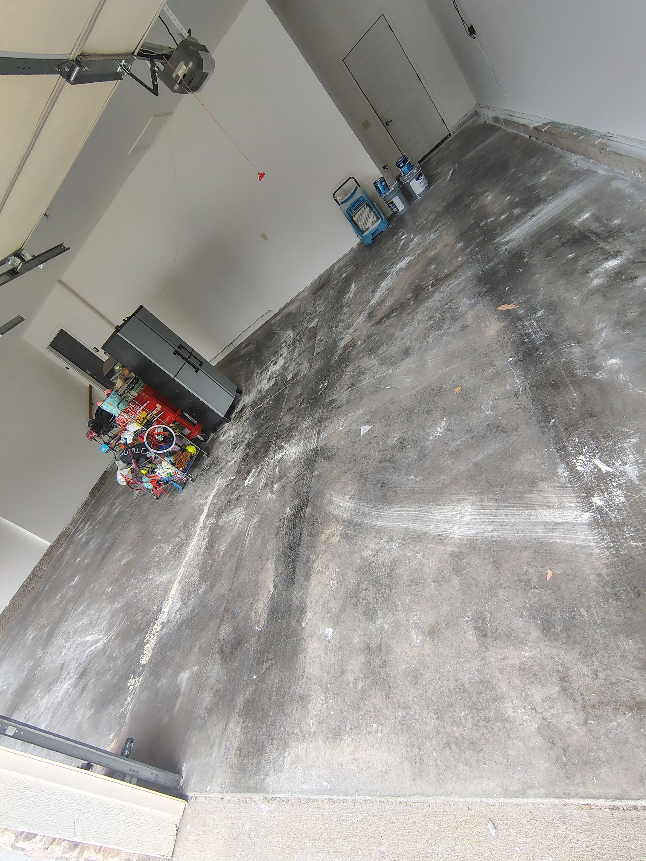Custom Grey Speckled Epoxy Floor Coating for Sioux Falls Garage by Select Painting, Coatings & Garage Cabinets